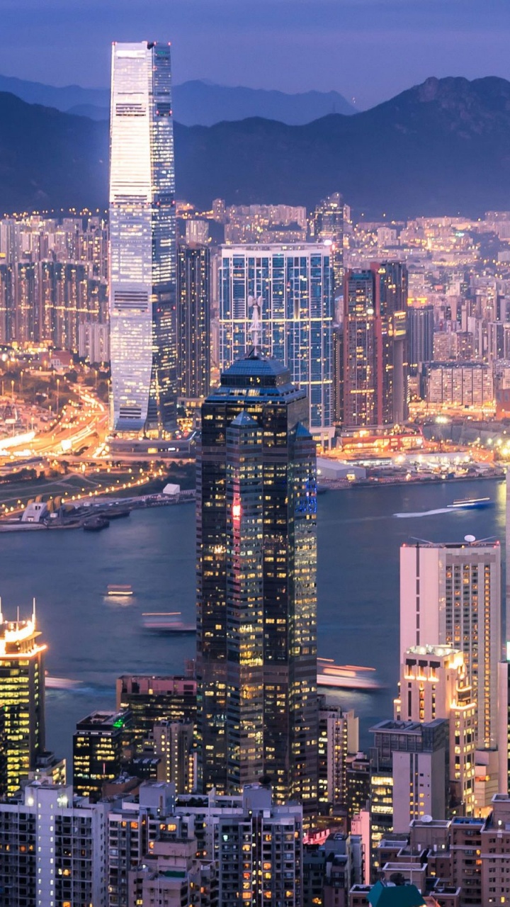 City Skyline During Night Time. Wallpaper in 720x1280 Resolution