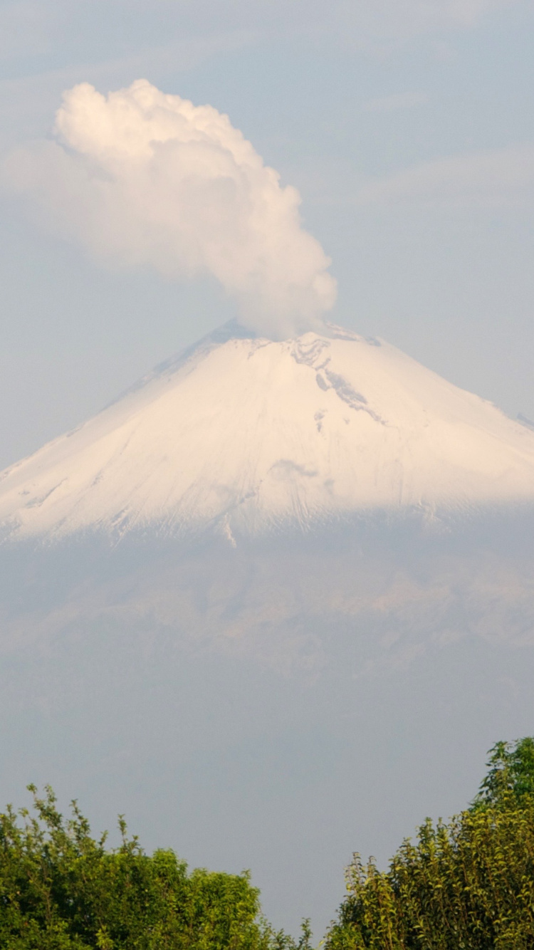 White Clouds Over Snow Covered Mountain. Wallpaper in 750x1334 Resolution