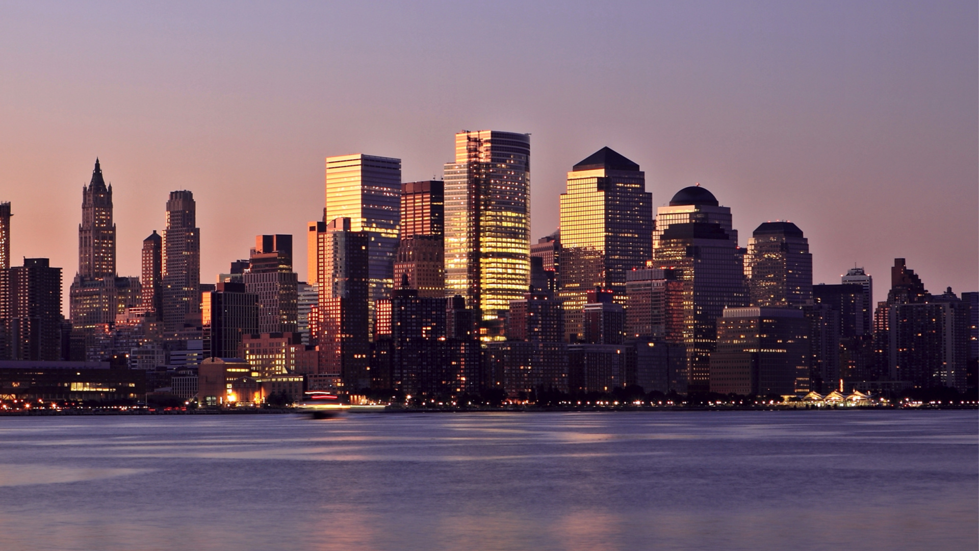 City Skyline Across Body of Water During Night Time. Wallpaper in 1920x1080 Resolution