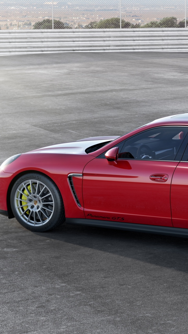 Red Coupe on Gray Asphalt Road During Daytime. Wallpaper in 720x1280 Resolution