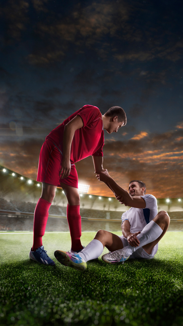 Homme en Chemise Rouge et Pantalon Blanc Jouant au Football. Wallpaper in 750x1334 Resolution