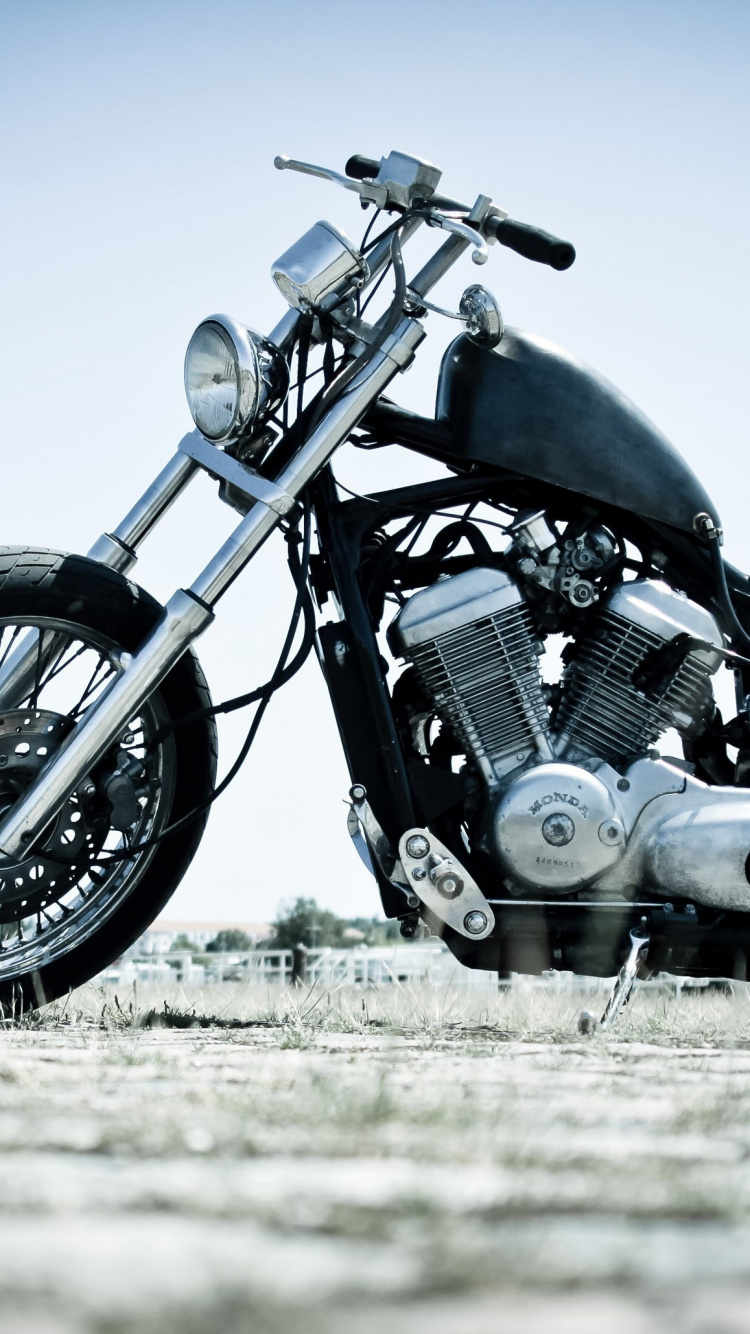 Black and Gray Motorcycle on Brown Field During Daytime. Wallpaper in 750x1334 Resolution