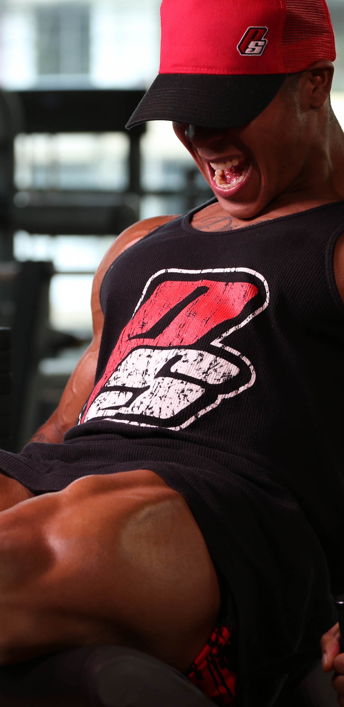 Man in Black Tank Top and Red Fitted Cap. Wallpaper in 1440x2960 Resolution