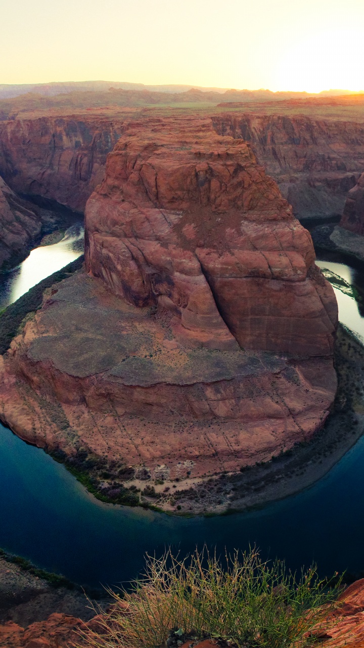 Brown Rock Formation Near Blue Lake During Daytime. Wallpaper in 720x1280 Resolution
