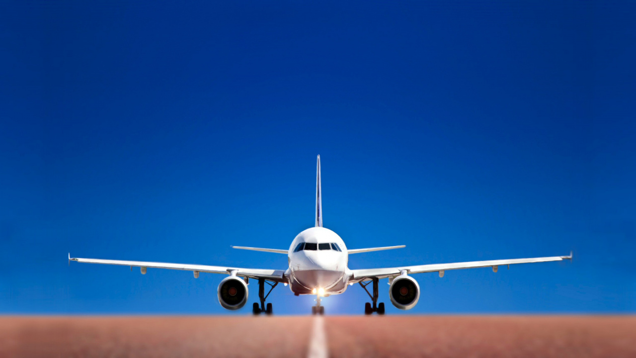 Avion Blanc Dans Les Airs Pendant la Journée. Wallpaper in 1280x720 Resolution