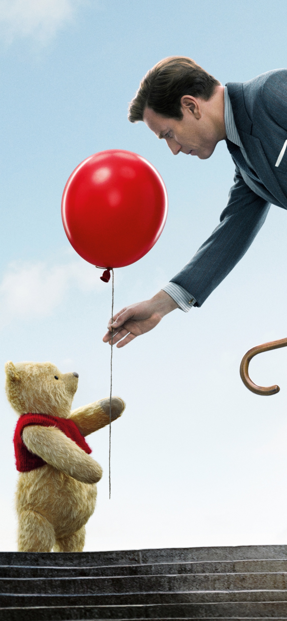 Homme en Veste Noire et Pantalon Noir Tenant Des Ballons Rouges. Wallpaper in 1125x2436 Resolution