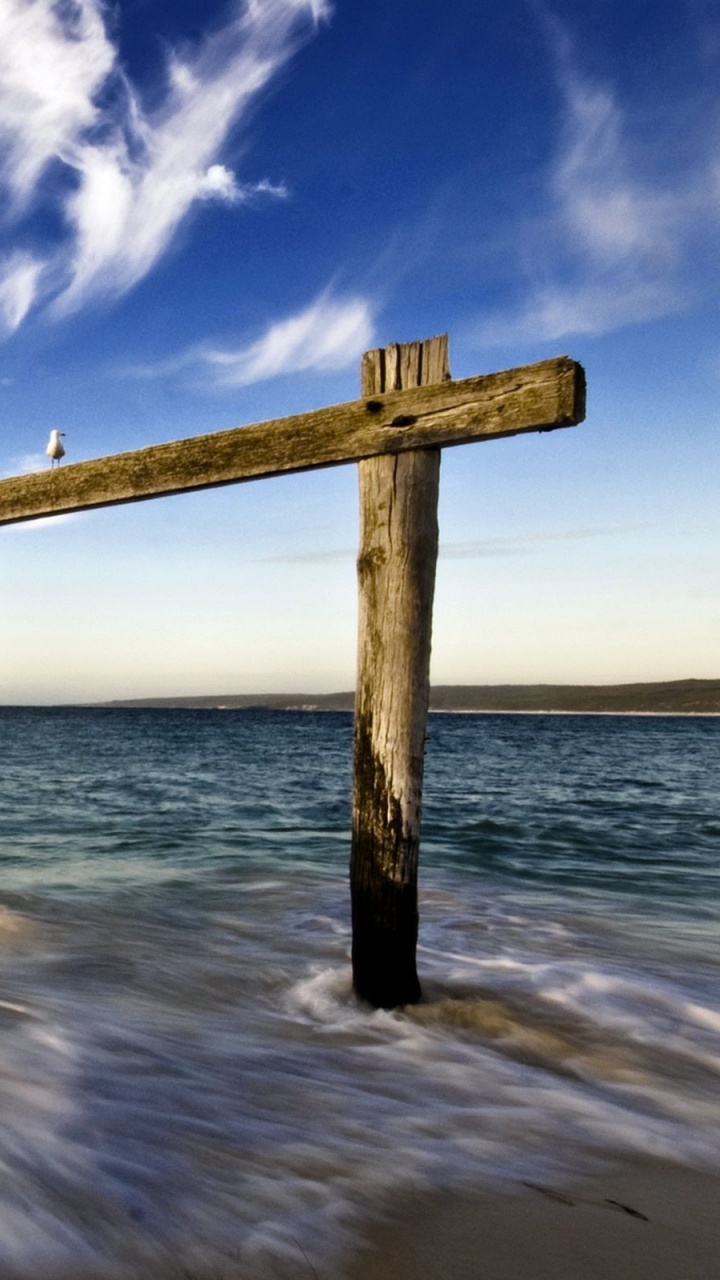 Brown Wooden Post on Sea Water Under Blue Sky During Daytime. Wallpaper in 720x1280 Resolution