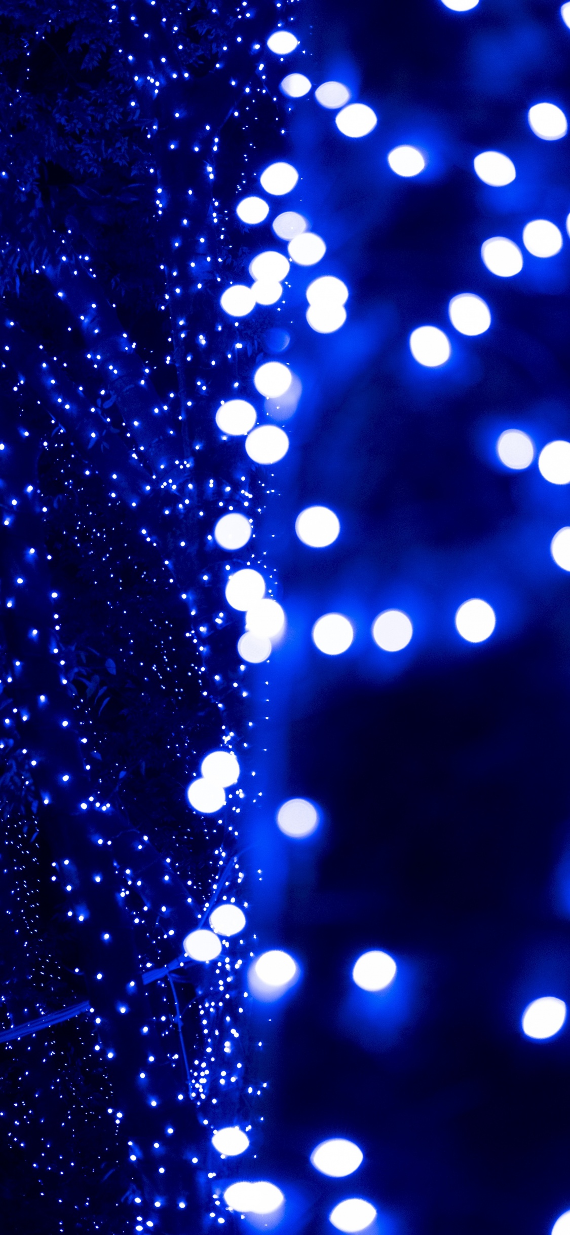 Blue and White Light Bokeh. Wallpaper in 1125x2436 Resolution