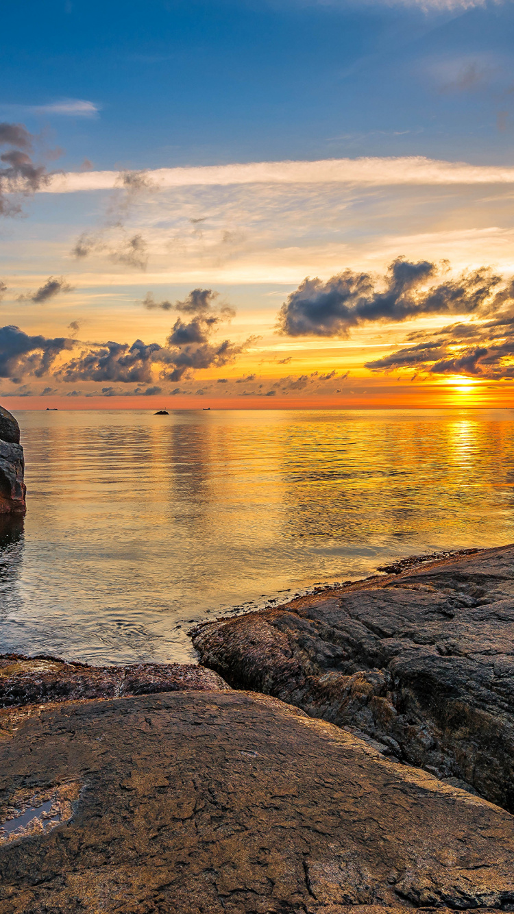 Body of Water Under Blue Sky During Sunset. Wallpaper in 750x1334 Resolution