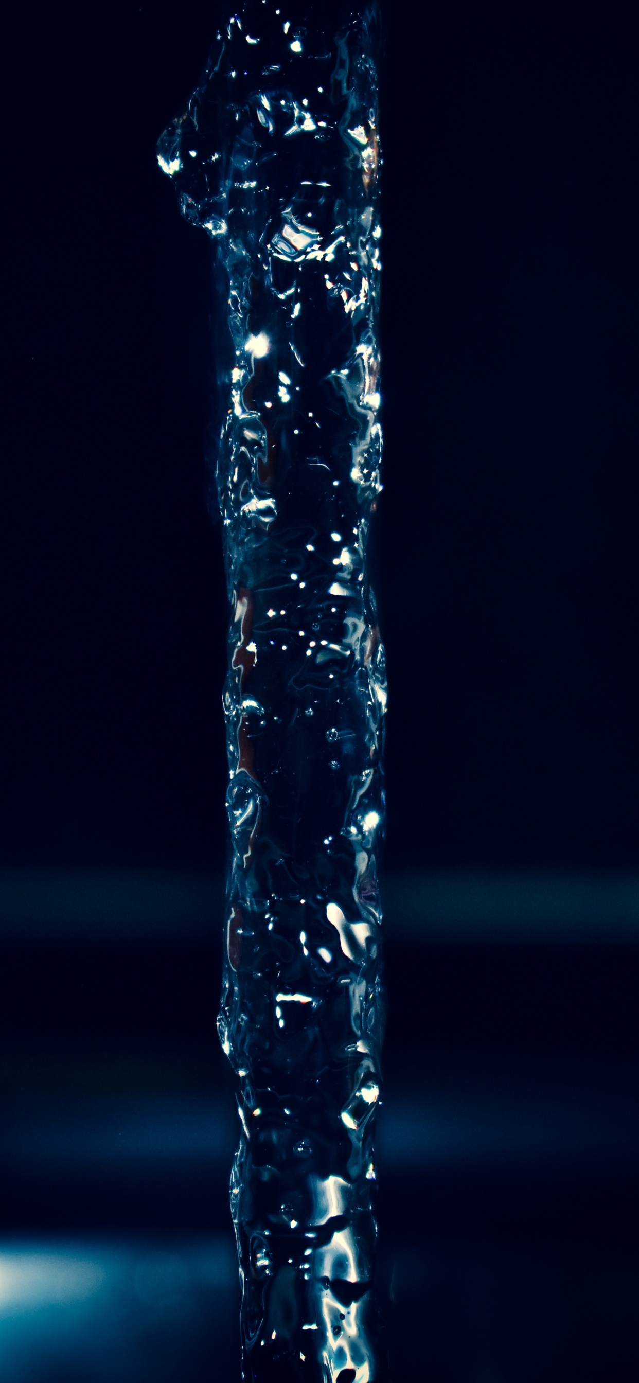 Water Splash on Black Background. Wallpaper in 1242x2688 Resolution