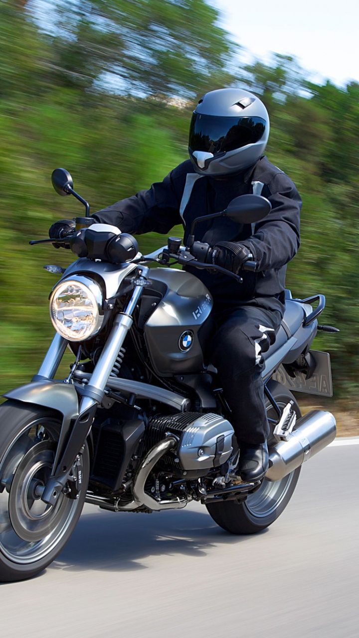 Man in Black Helmet Riding Motorcycle on Road During Daytime. Wallpaper in 720x1280 Resolution