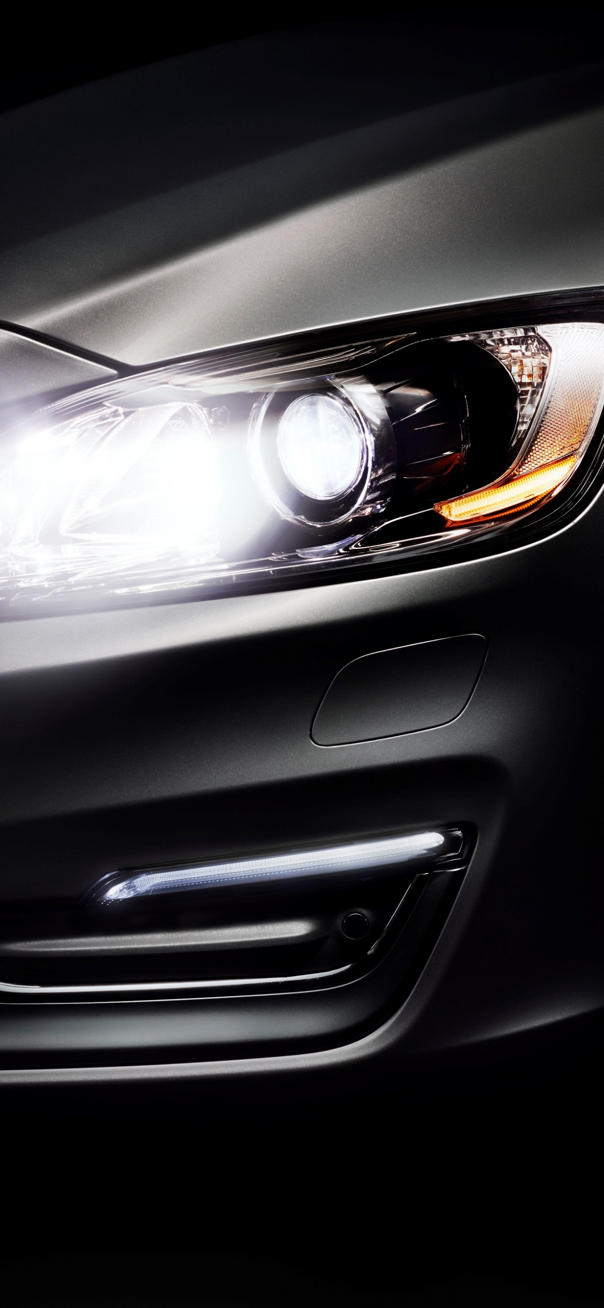 Silver Car With Black and Brown Headlight. Wallpaper in 1242x2688 Resolution