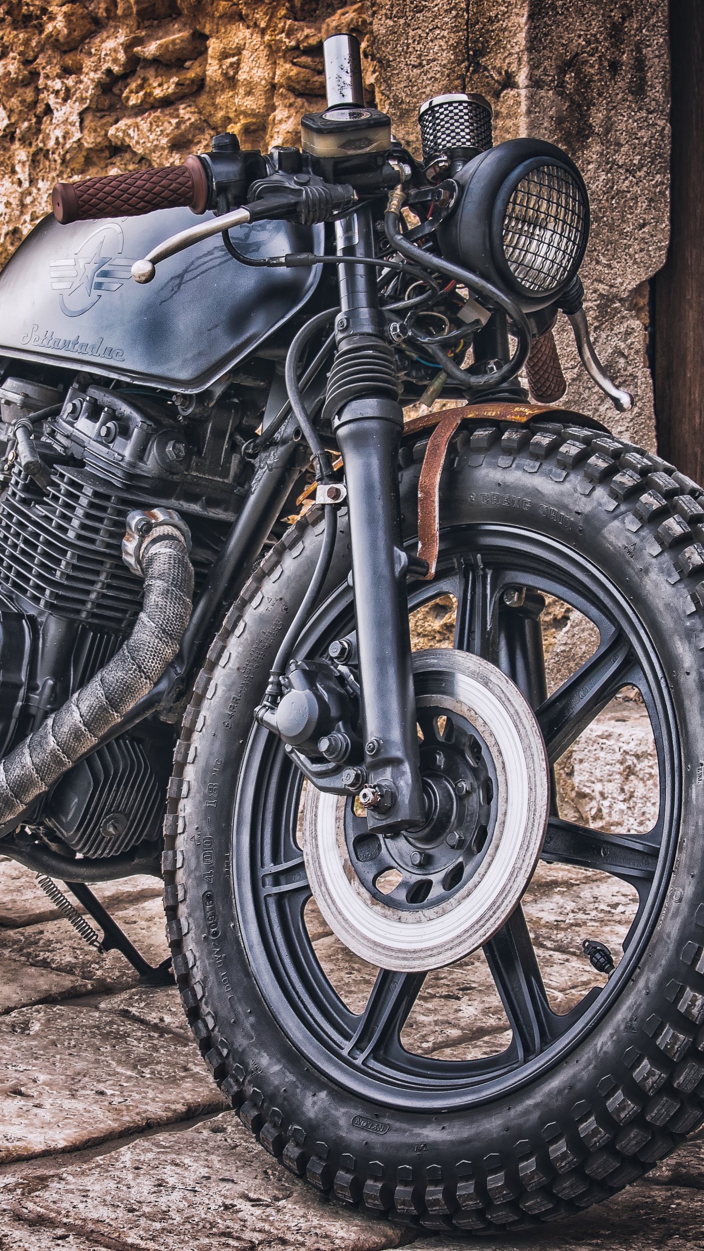 Black and Silver Motorcycle Near Brown Wooden Wall. Wallpaper in 1440x2560 Resolution