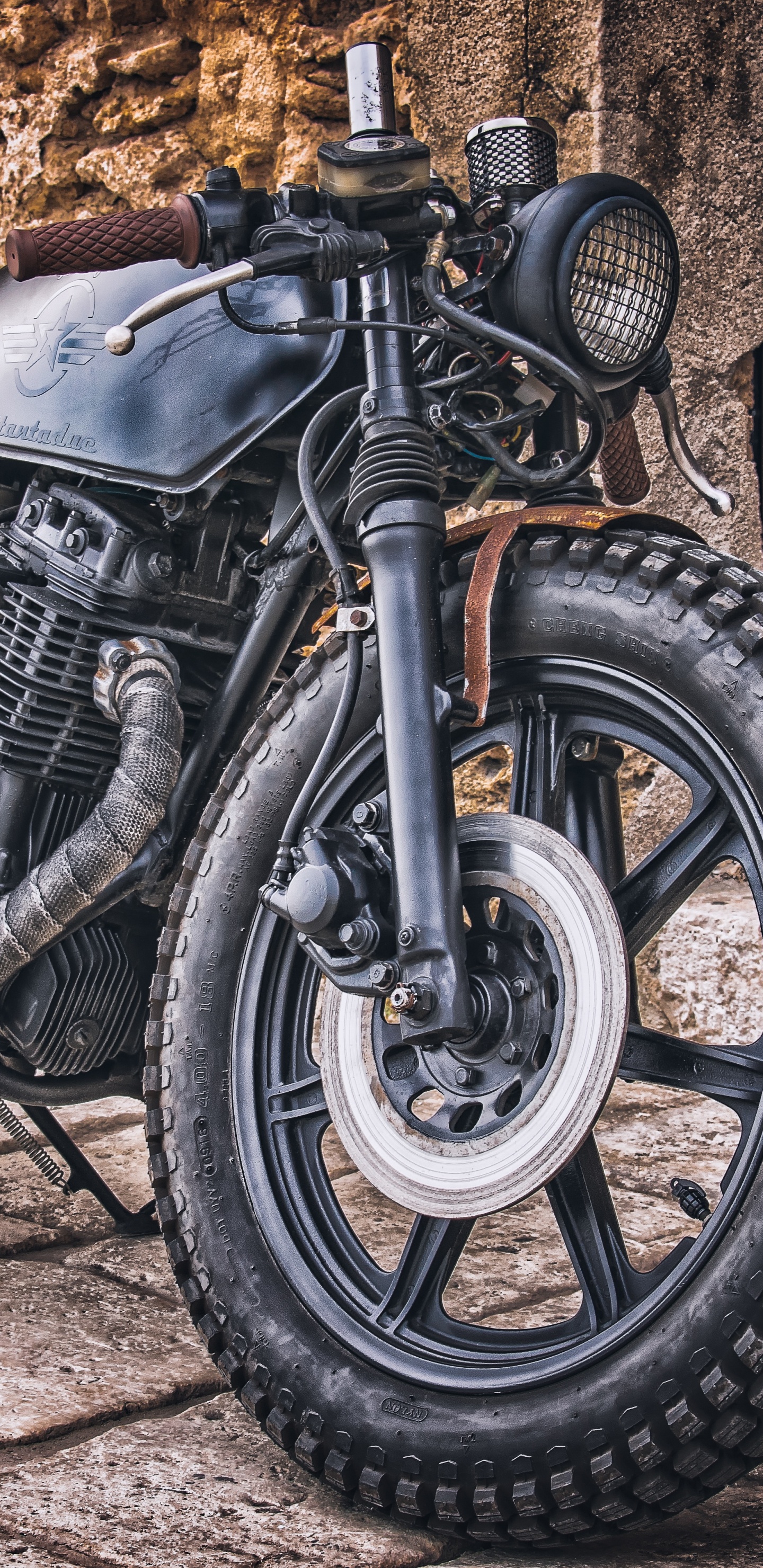 Black and Silver Motorcycle Near Brown Wooden Wall. Wallpaper in 1440x2960 Resolution