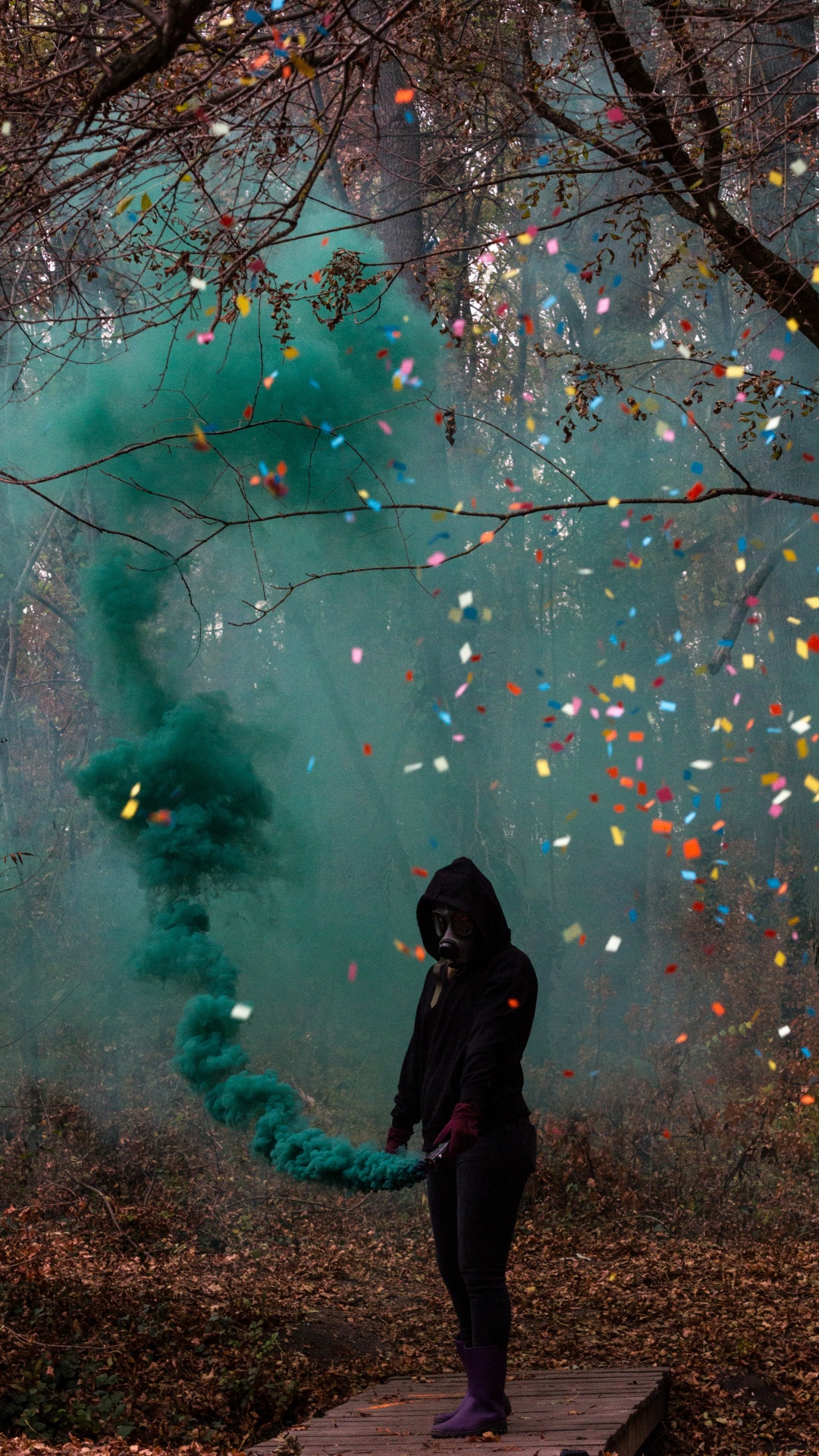 Woman in Black Jacket Standing Under Green and Pink String Lights. Wallpaper in 1080x1920 Resolution