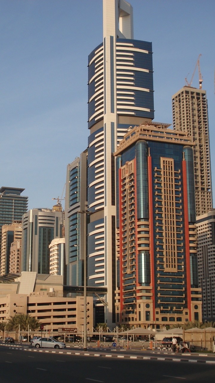 White and Brown High Rise Buildings. Wallpaper in 720x1280 Resolution