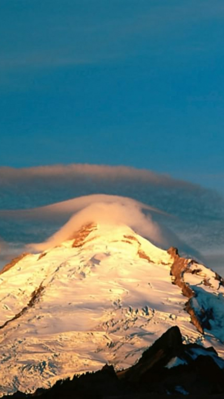 Snow Covered Mountain Under Blue Sky During Daytime. Wallpaper in 750x1334 Resolution