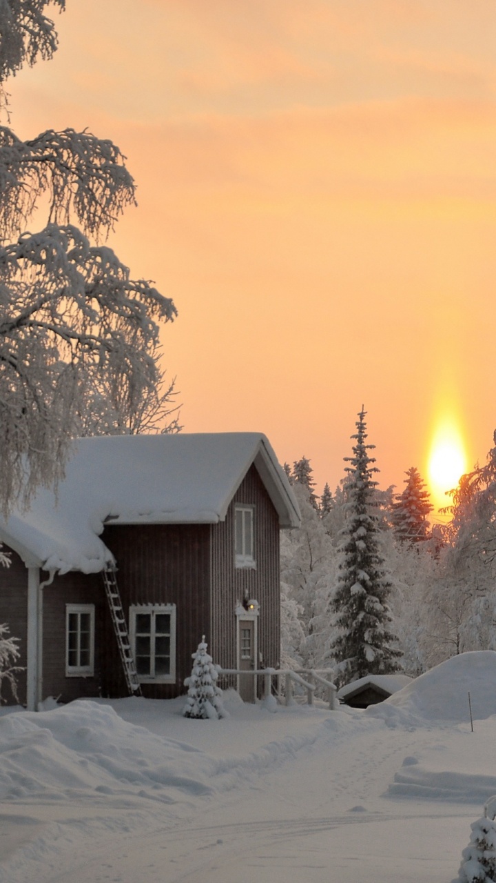 Brown Wooden House Covered With Snow During Sunset. Wallpaper in 720x1280 Resolution