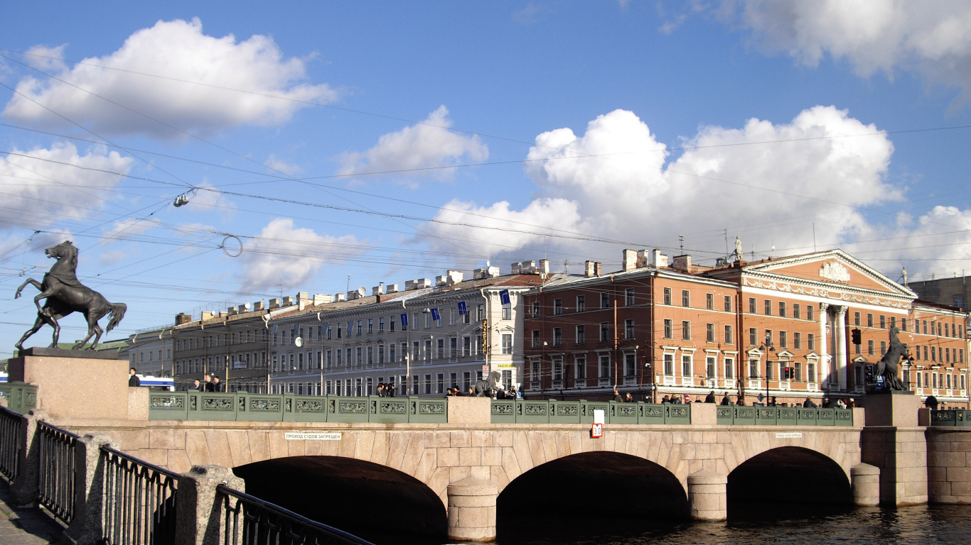 White and Brown Concrete Building Under Blue Sky During Daytime. Wallpaper in 1366x768 Resolution