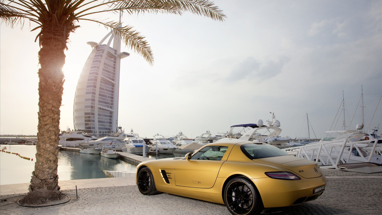 Yellow Porsche 911 Parked Near Palm Trees and Buildings During Daytime. Wallpaper in 1280x720 Resolution