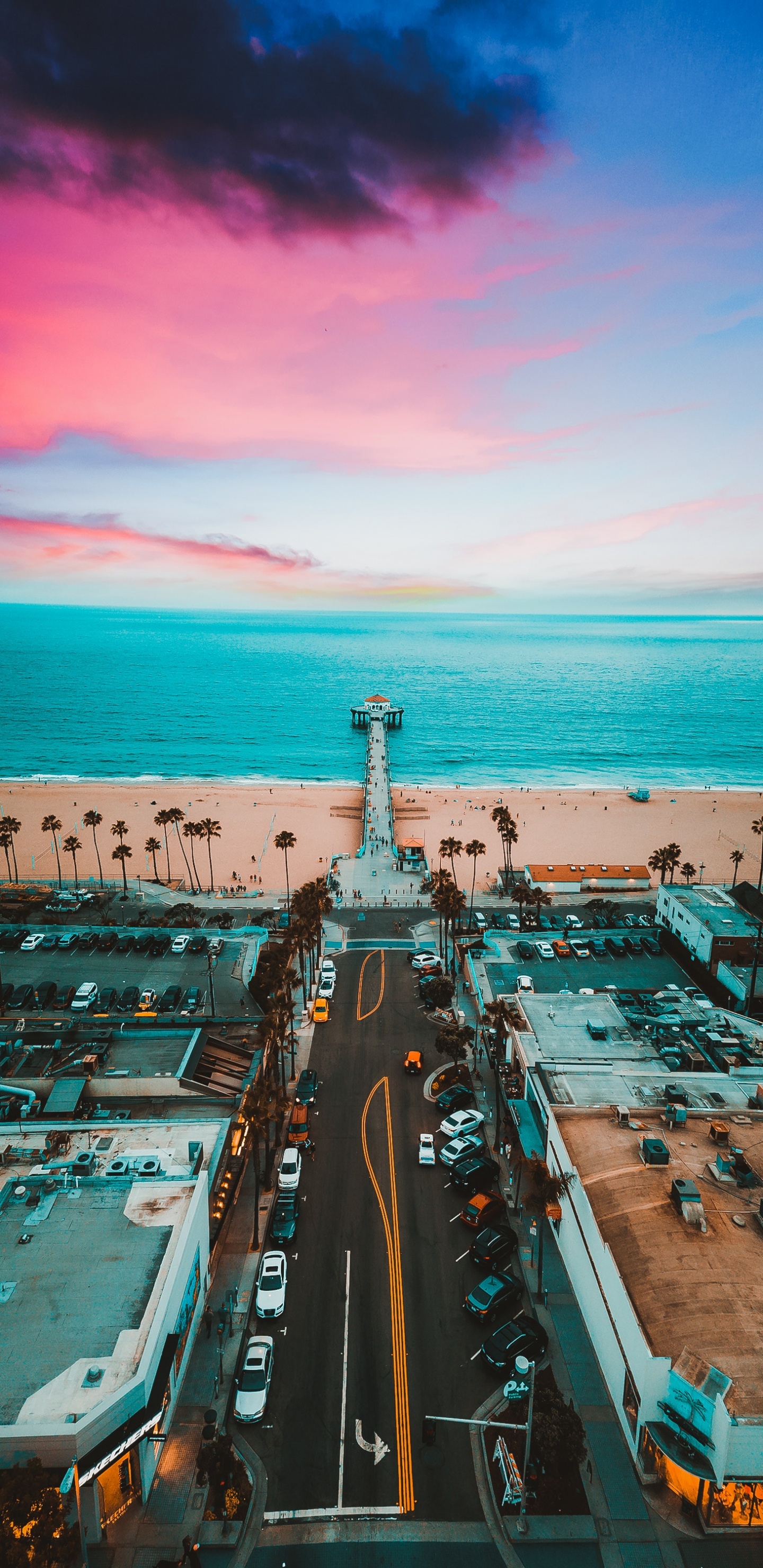 Aerial View of City Buildings Near Body of Water During Daytime. Wallpaper in 1440x2960 Resolution