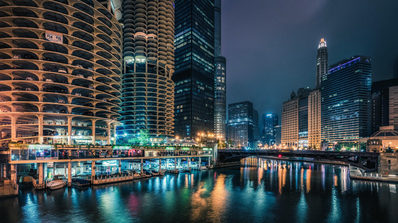 Body of Water Between High Rise Buildings During Night Time. Wallpaper in 1366x768 Resolution