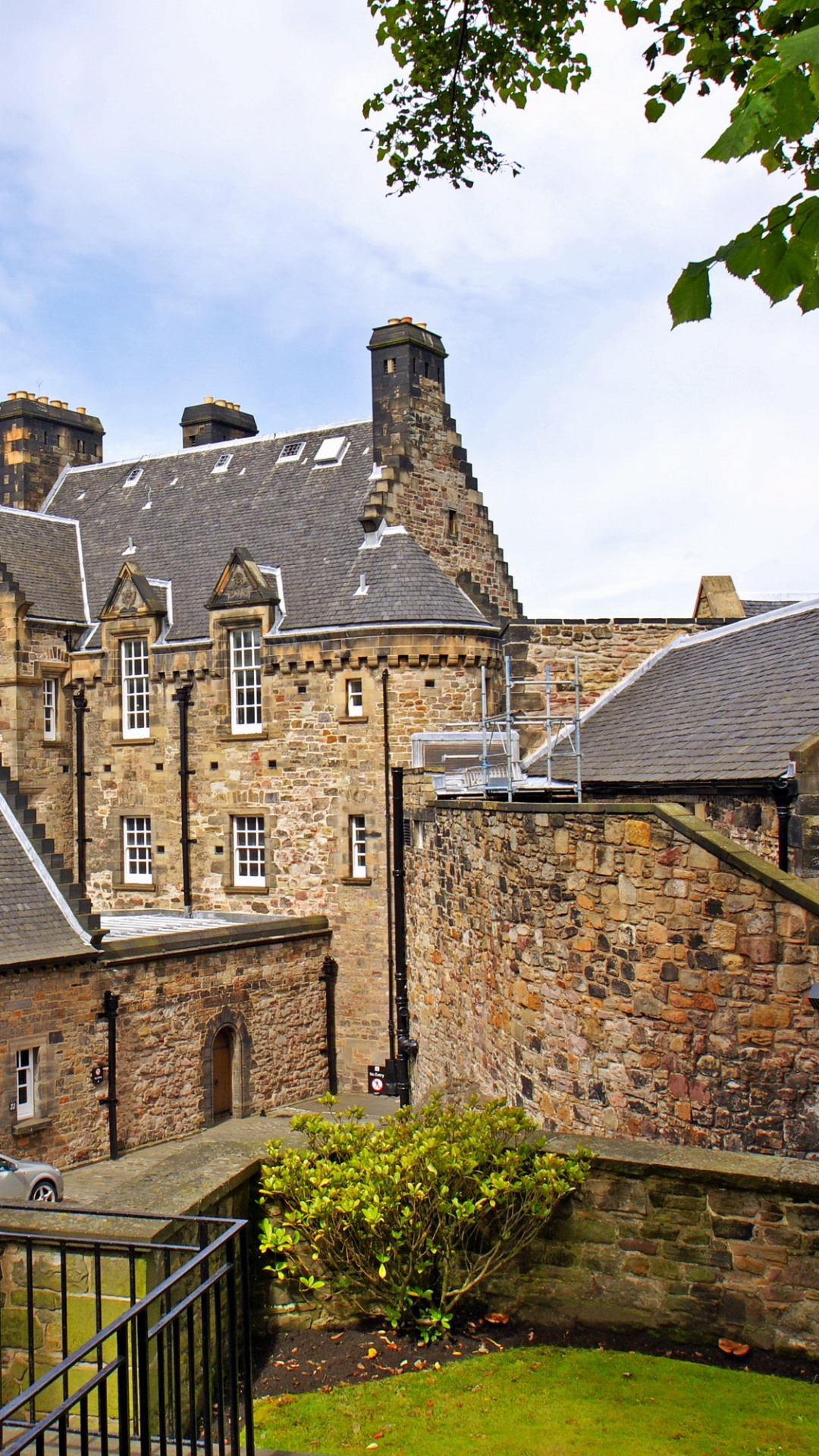 Brown Brick Building Near Green Grass Field During Daytime. Wallpaper in 1080x1920 Resolution