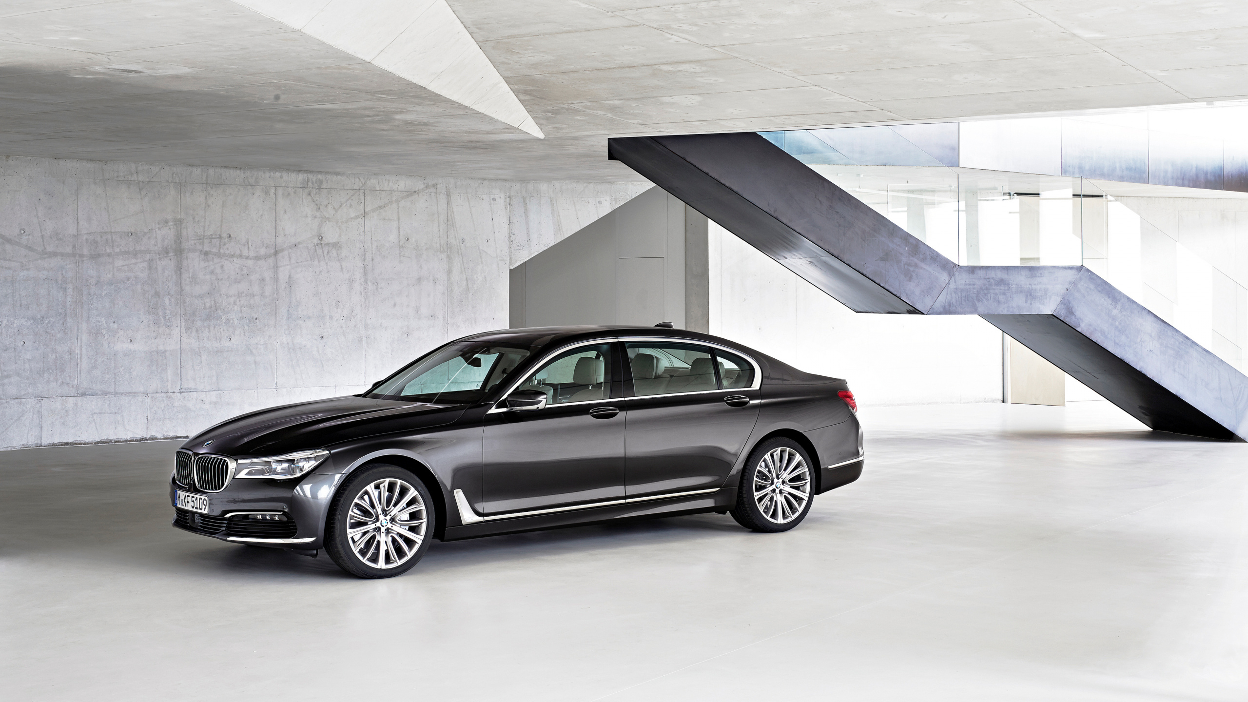 Gray Mercedes Benz Coupe Parked on Gray Concrete Floor. Wallpaper in 2560x1440 Resolution