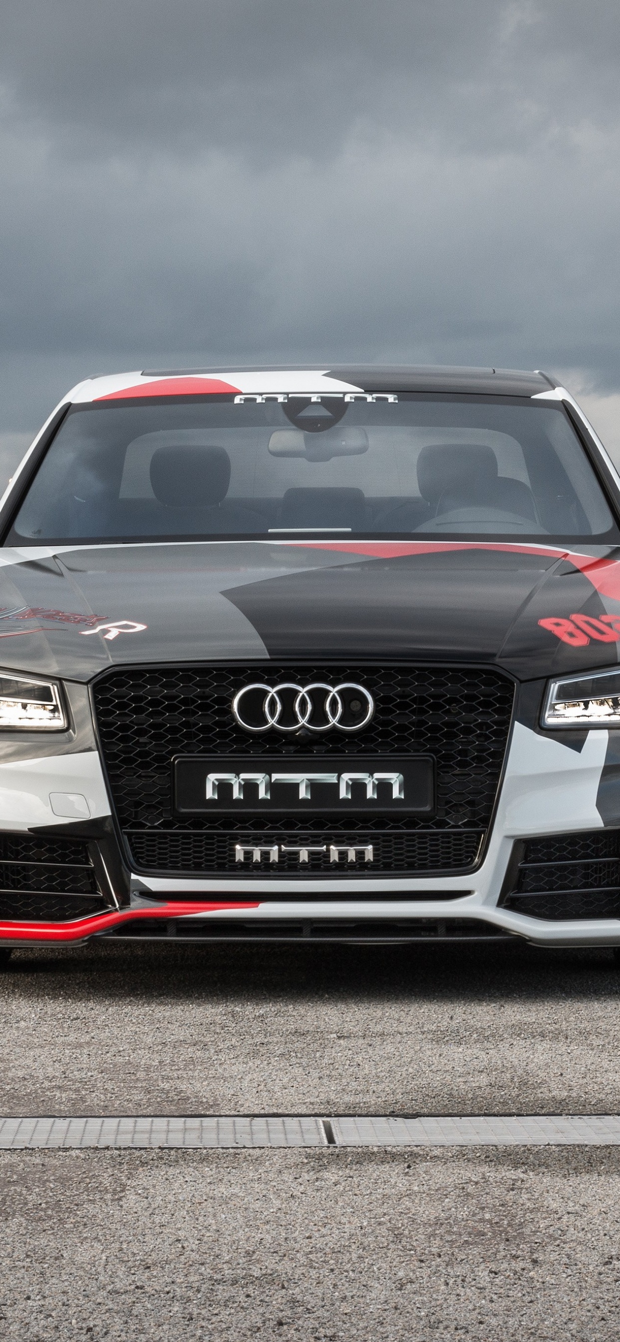 Black Audi a 4 on a Gray Asphalt Road. Wallpaper in 1242x2688 Resolution