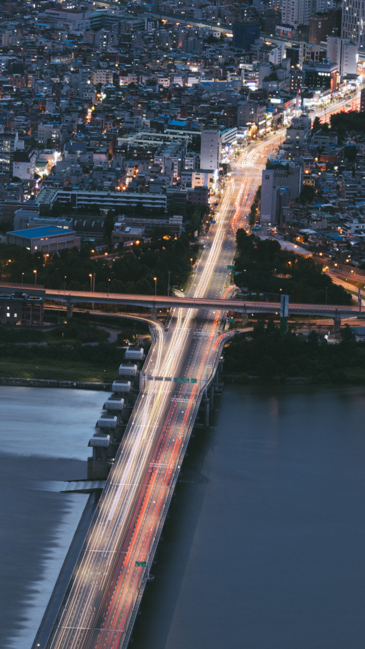 Aerial View of City Buildings During Night Time. Wallpaper in 750x1334 Resolution
