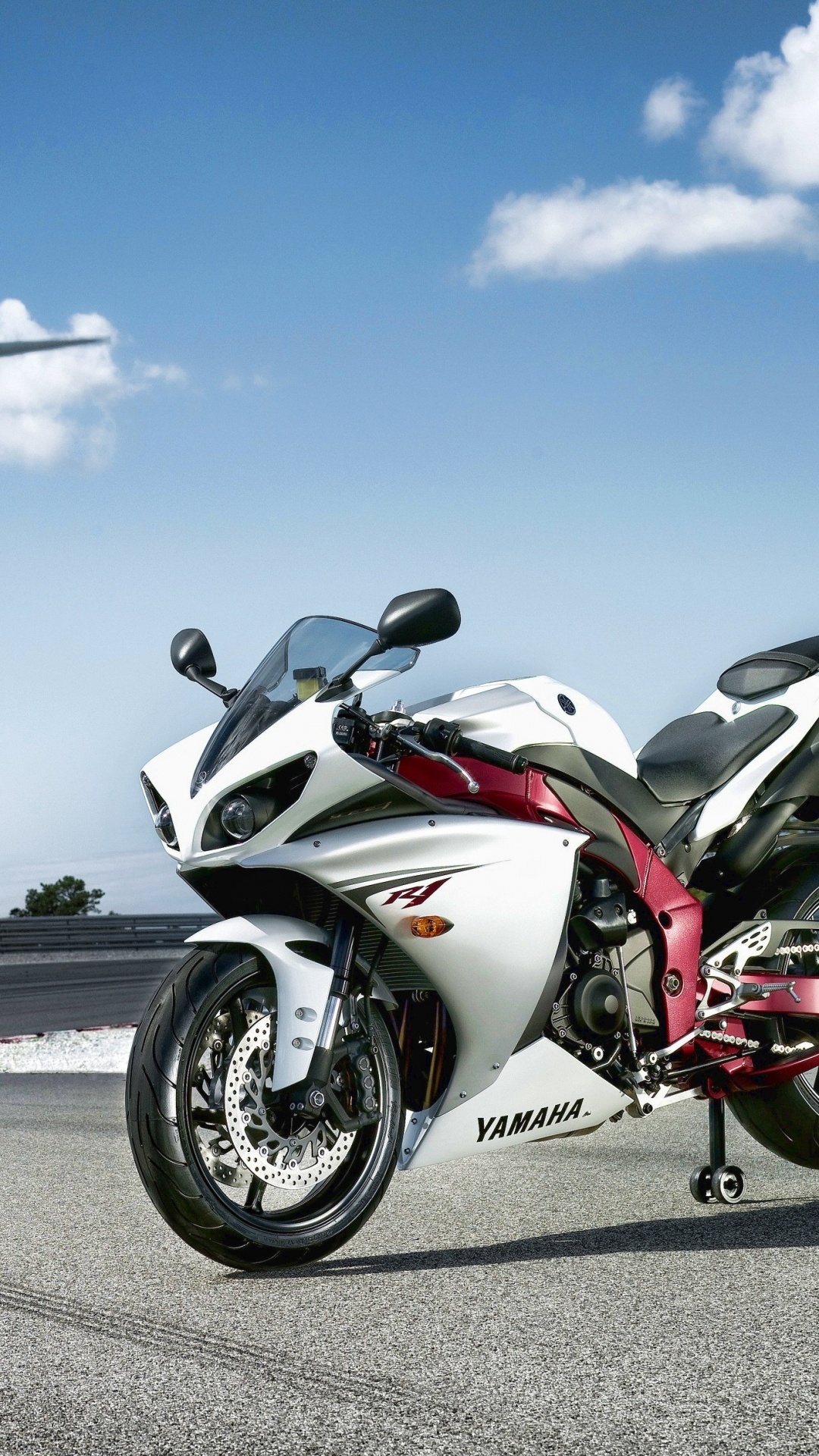 White and Red Sports Bike on Road During Daytime. Wallpaper in 1080x1920 Resolution