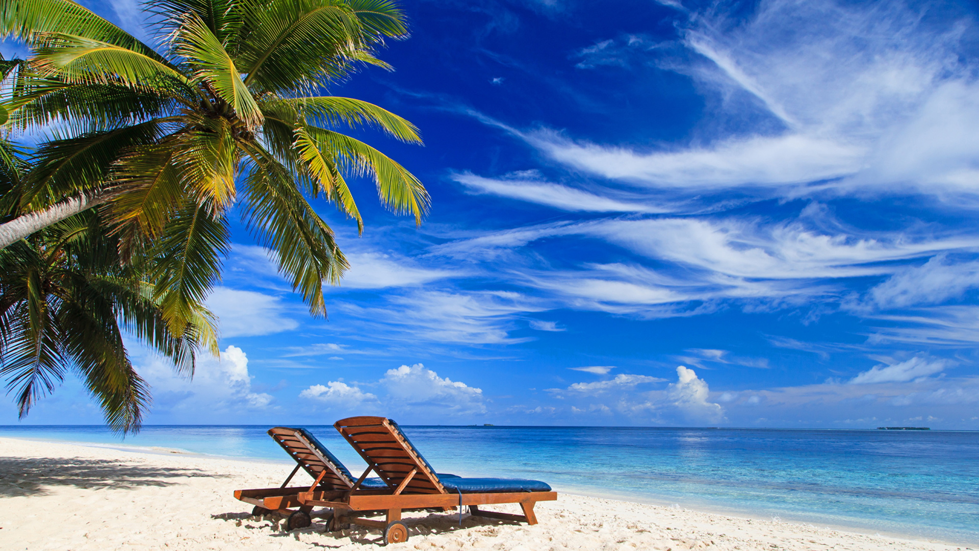 Brown Wooden Lounge Chair on Beach During Daytime. Wallpaper in 1920x1080 Resolution