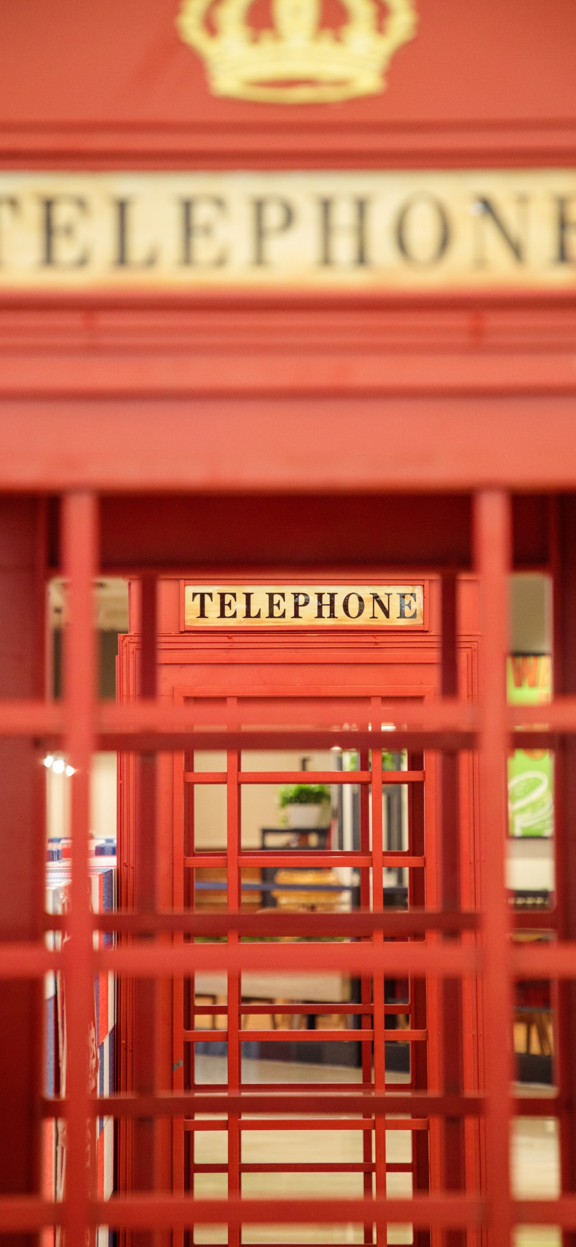 Red Wooden Telephone Booth With Red Wooden Frame. Wallpaper in 1125x2436 Resolution