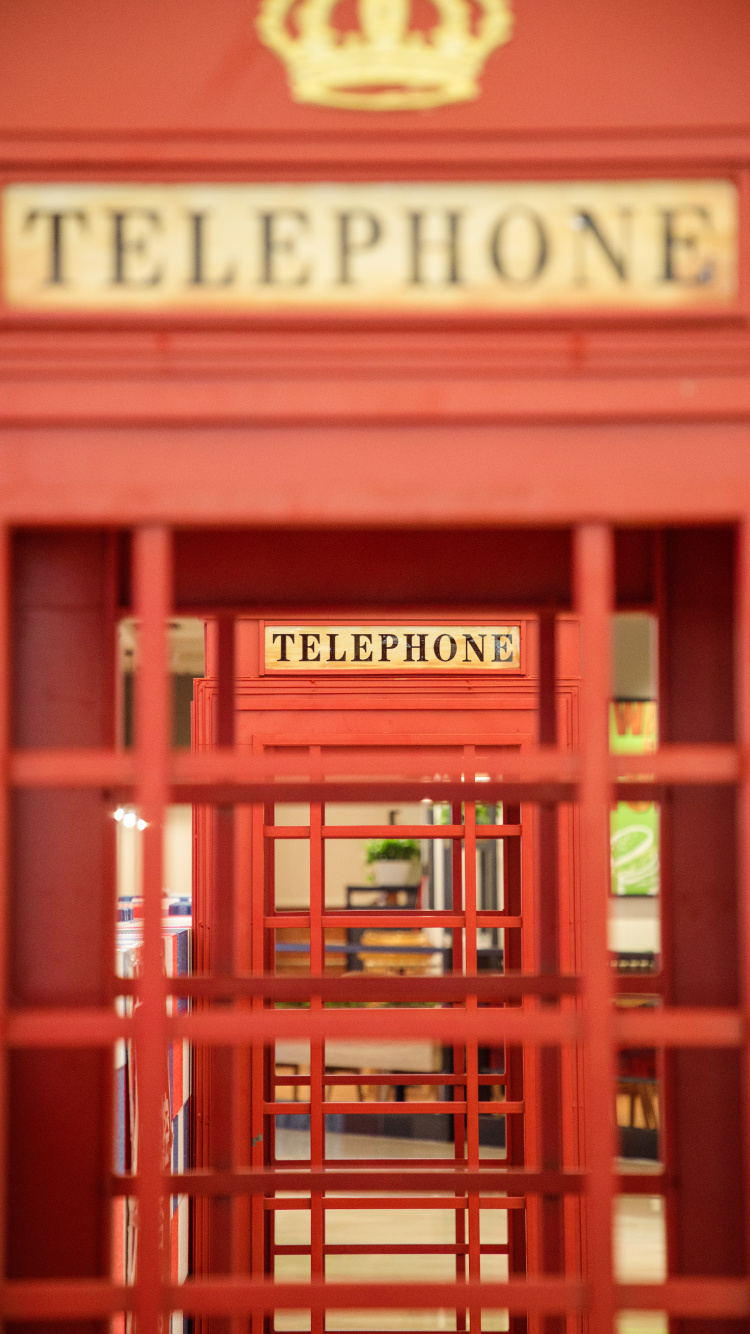 Red Wooden Telephone Booth With Red Wooden Frame. Wallpaper in 750x1334 Resolution