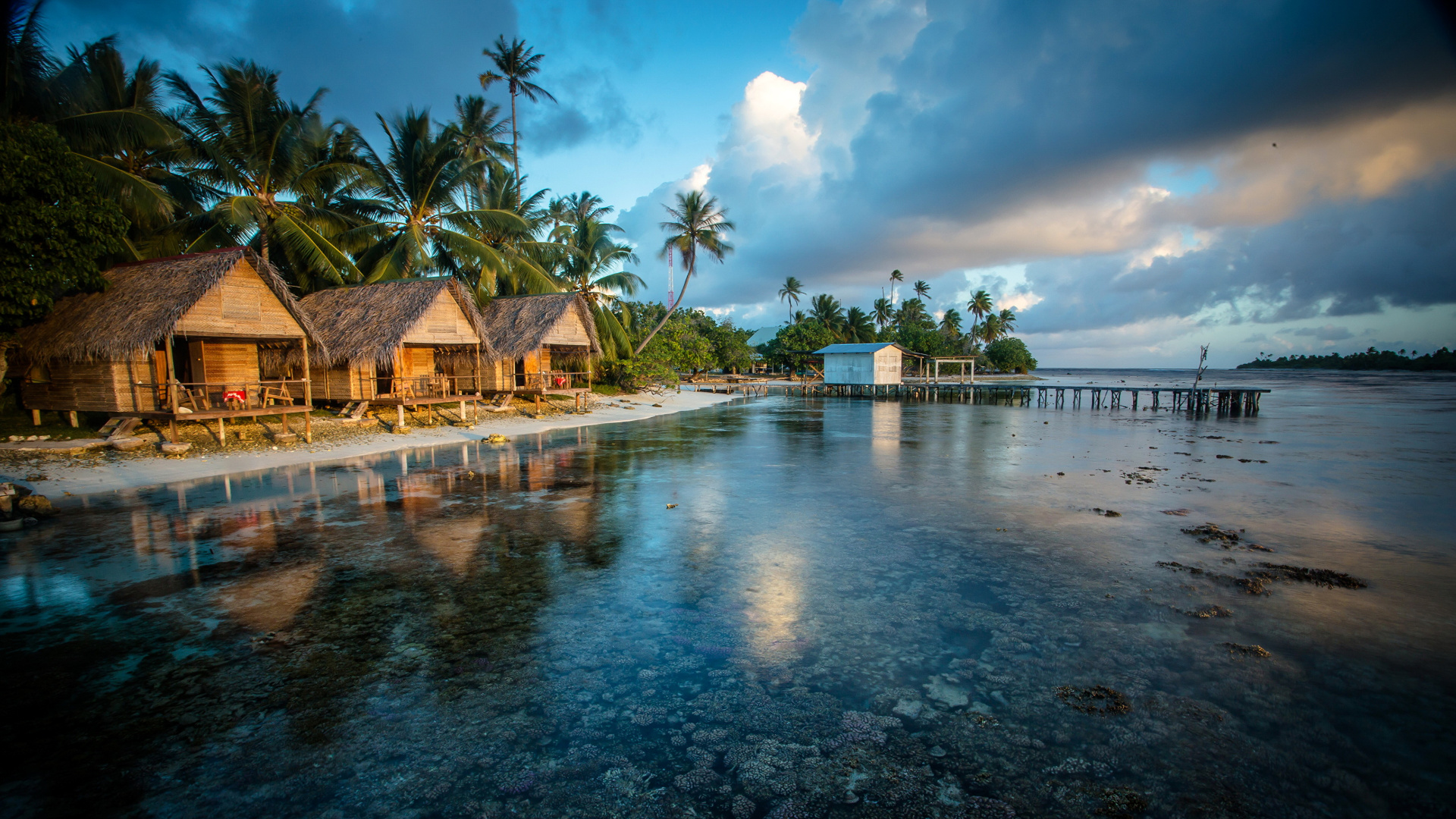 Brown Wooden House Near Body of Water During Daytime. Wallpaper in 1920x1080 Resolution