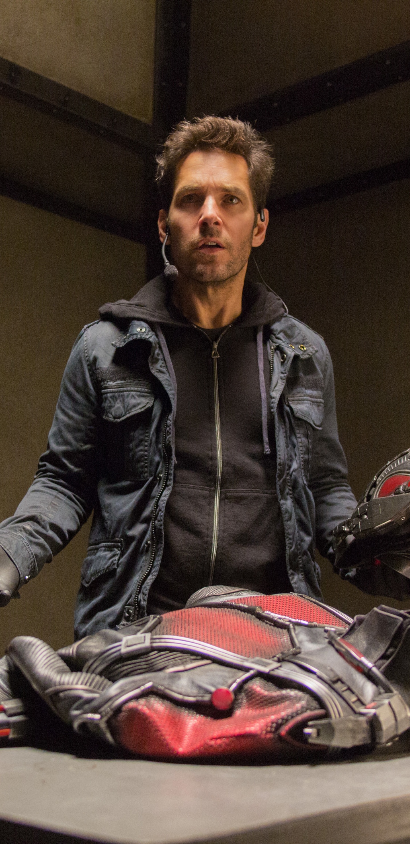 Man in Black Leather Jacket Sitting on Chair. Wallpaper in 1440x2960 Resolution