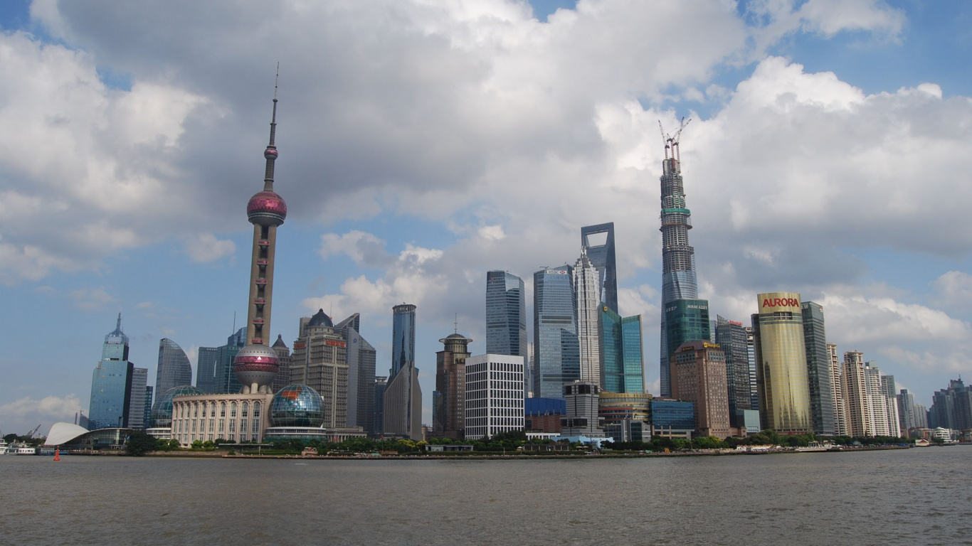 City Skyline Under Cloudy Sky During Daytime. Wallpaper in 1366x768 Resolution