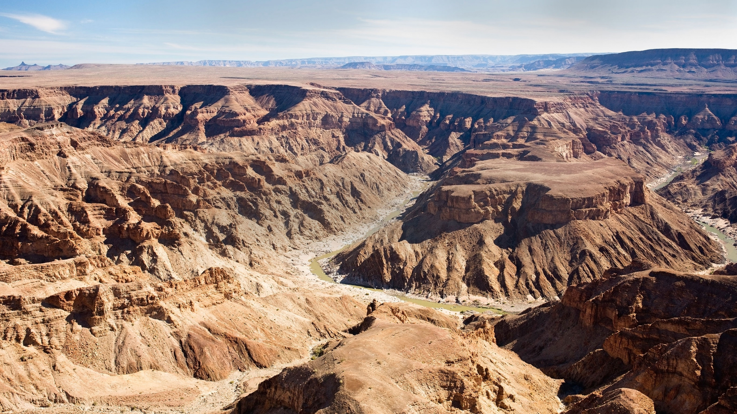 Brown Rocky Mountain Under Blue Sky During Daytime. Wallpaper in 2560x1440 Resolution