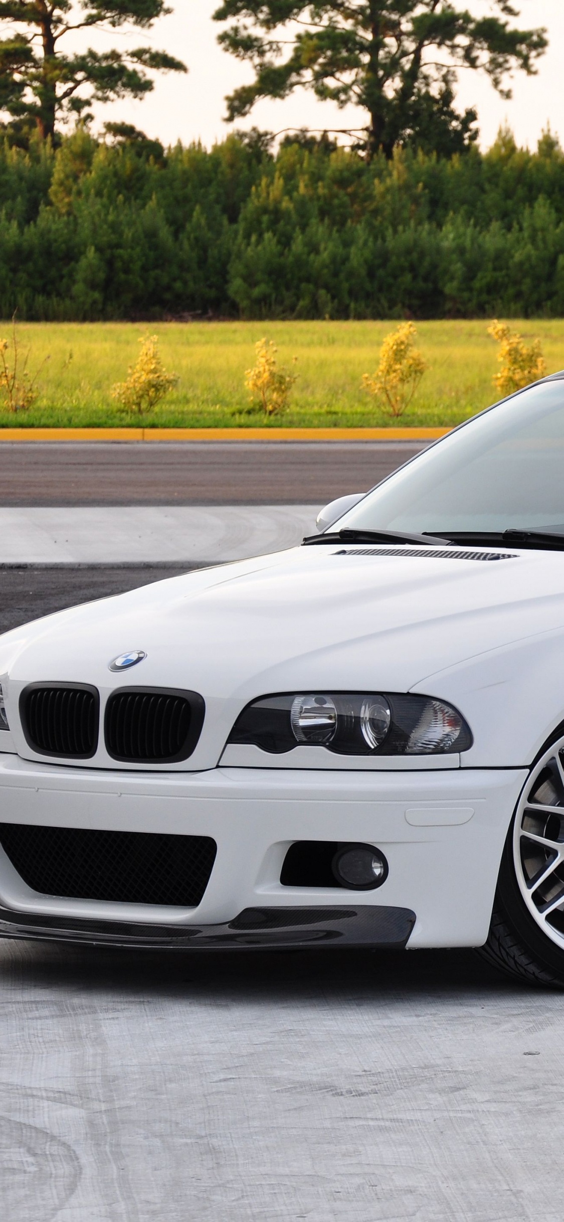 White Bmw m 3 Coupe on Road During Daytime. Wallpaper in 1125x2436 Resolution