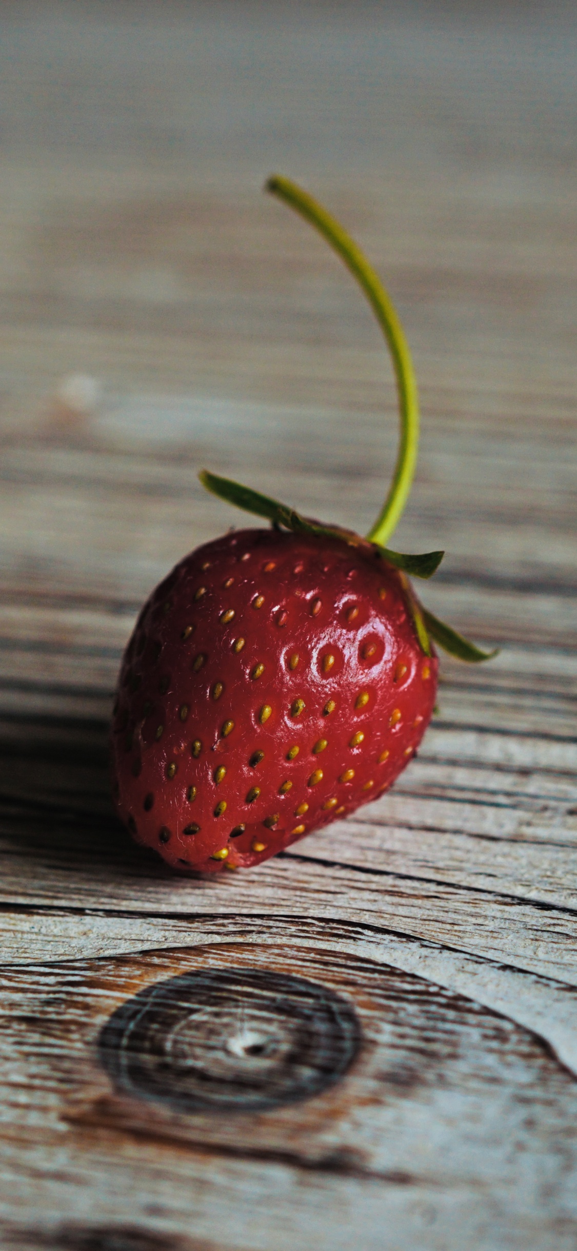 Red Strawberry on Brown Wooden Table. Wallpaper in 1125x2436 Resolution