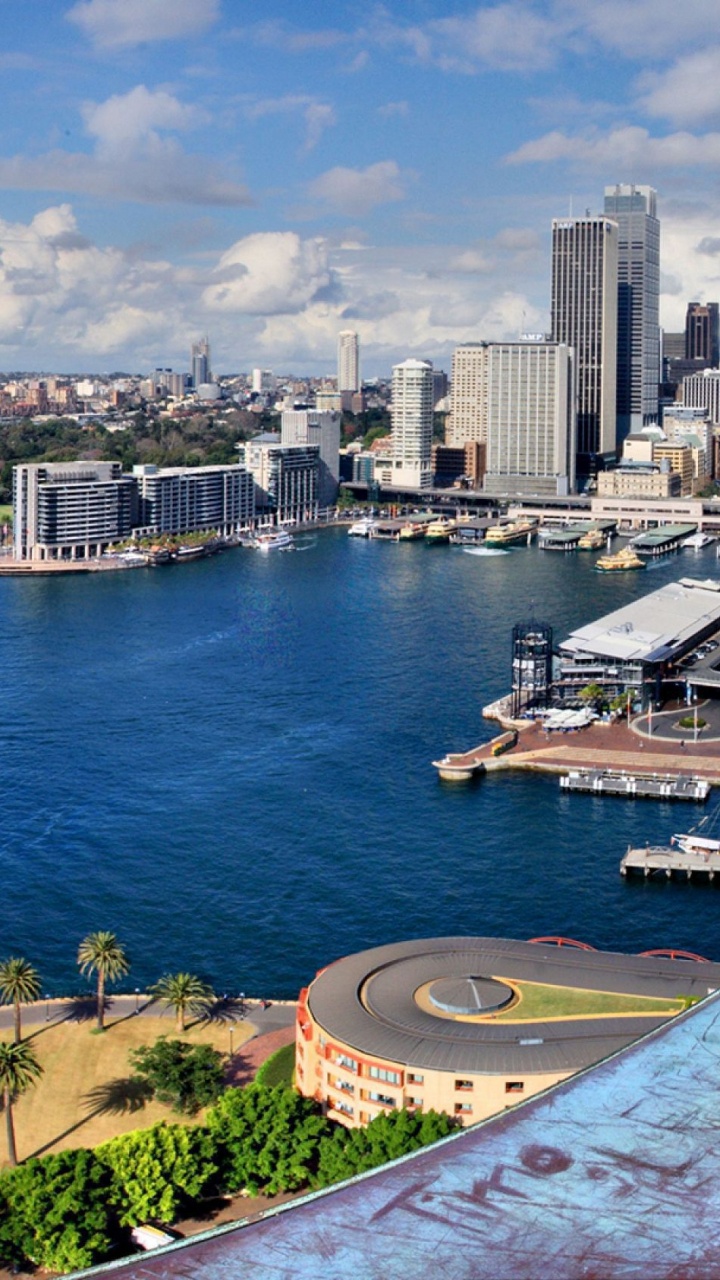 Aerial View of City Buildings Near Body of Water During Daytime. Wallpaper in 720x1280 Resolution