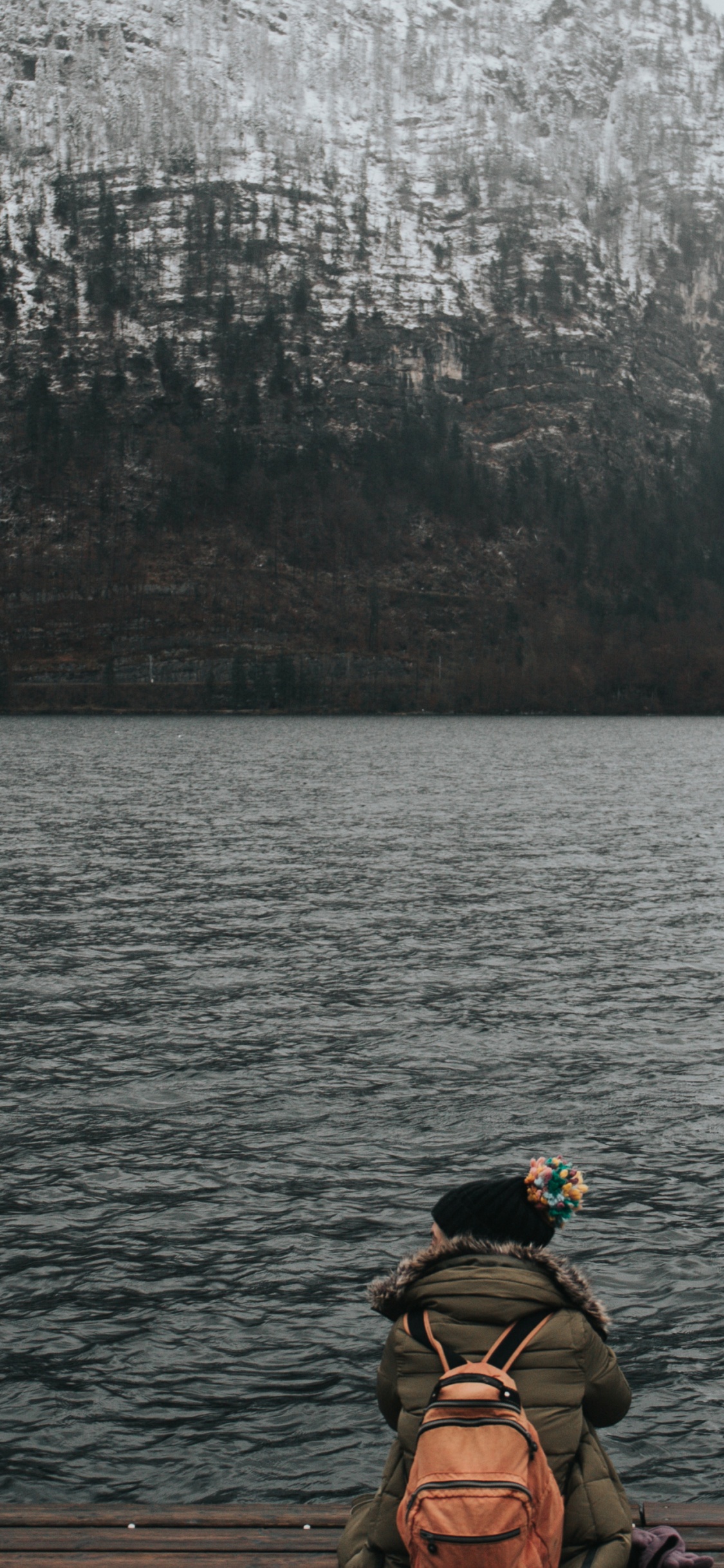 Man in Black and Yellow Goggles Riding Boat on Lake During Daytime. Wallpaper in 1125x2436 Resolution