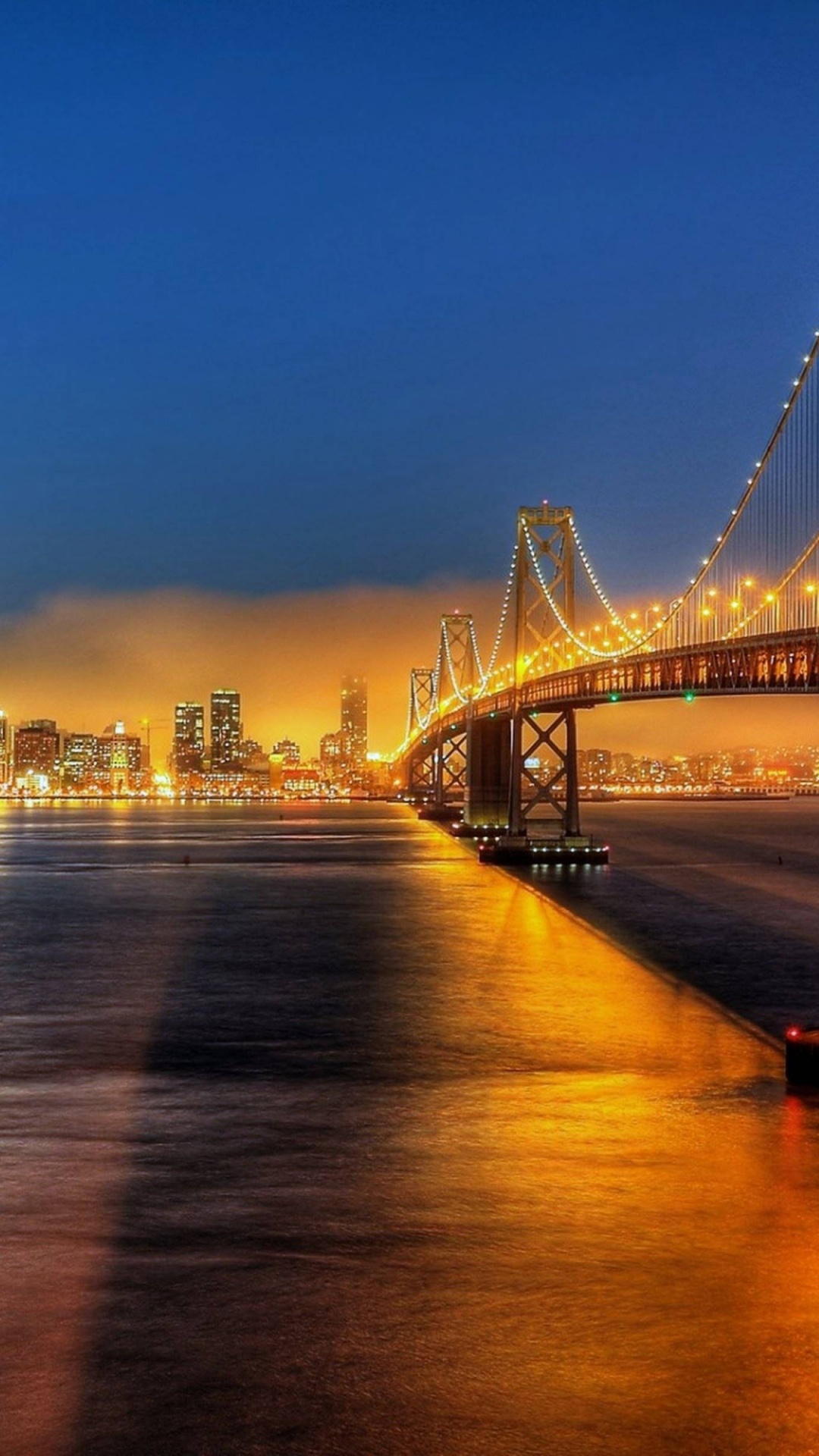 Brücke Über Wasser Während Der Nacht Night. Wallpaper in 1080x1920 Resolution