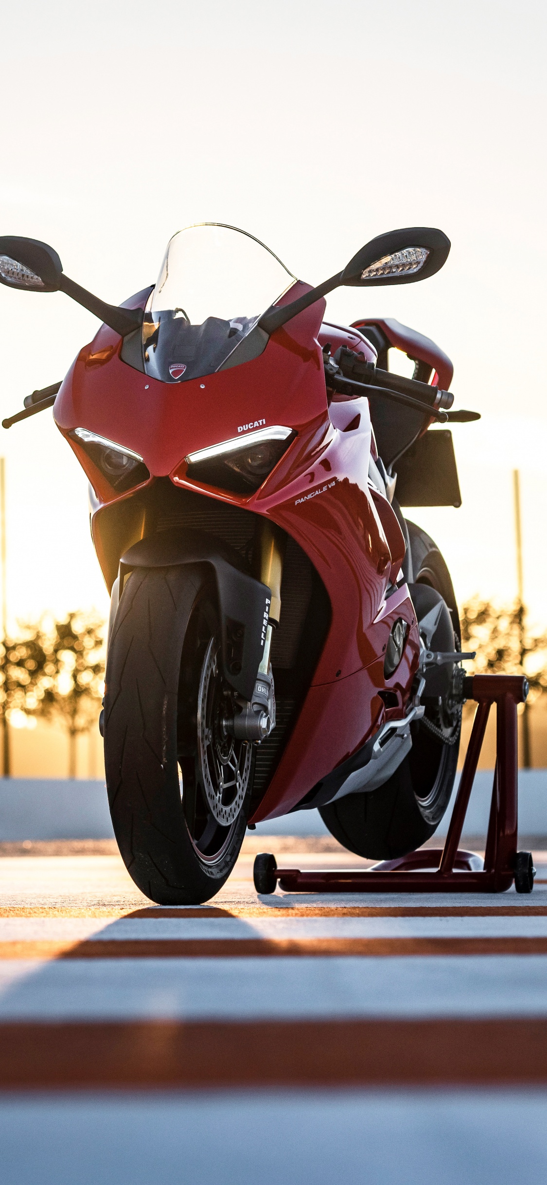 Red and Black Sports Bike on Road During Daytime. Wallpaper in 1125x2436 Resolution