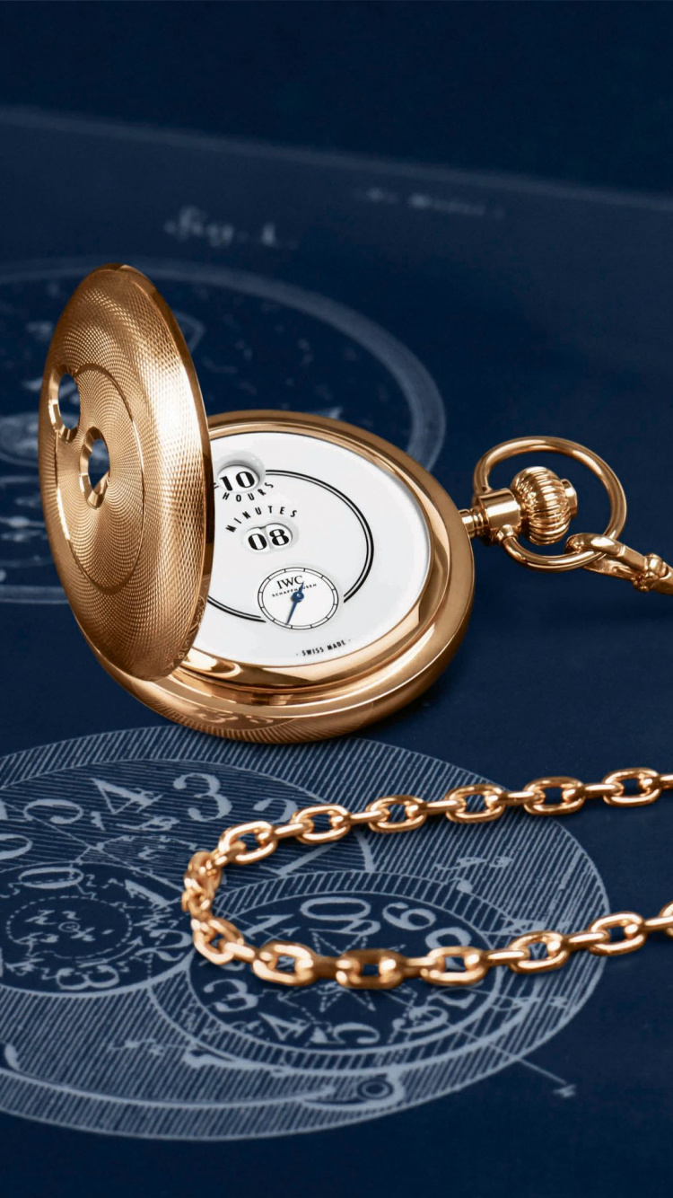 Gold Round Pocket Watch on Blue Textile. Wallpaper in 750x1334 Resolution