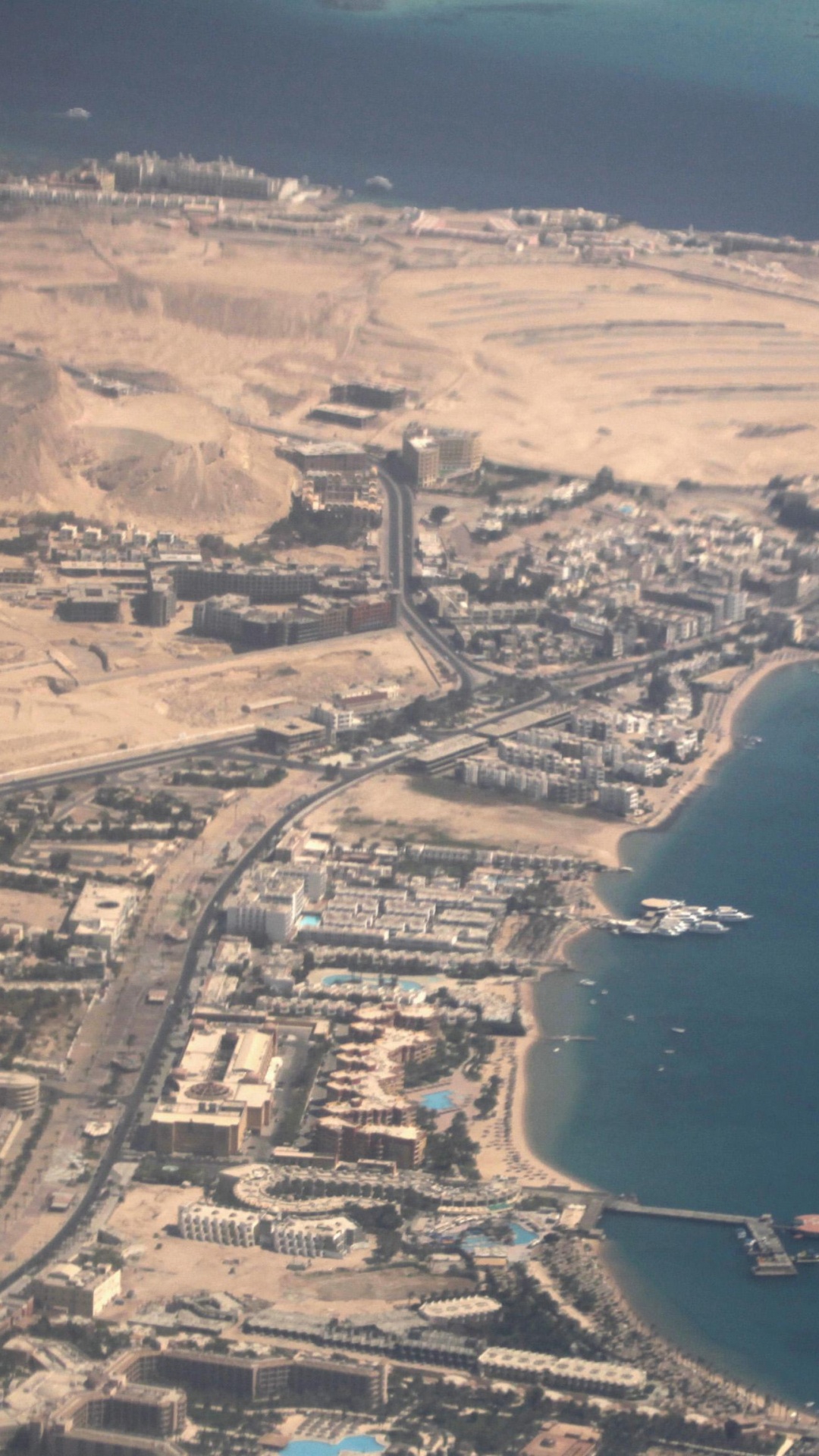 Aerial View of City Near Body of Water During Daytime. Wallpaper in 1080x1920 Resolution