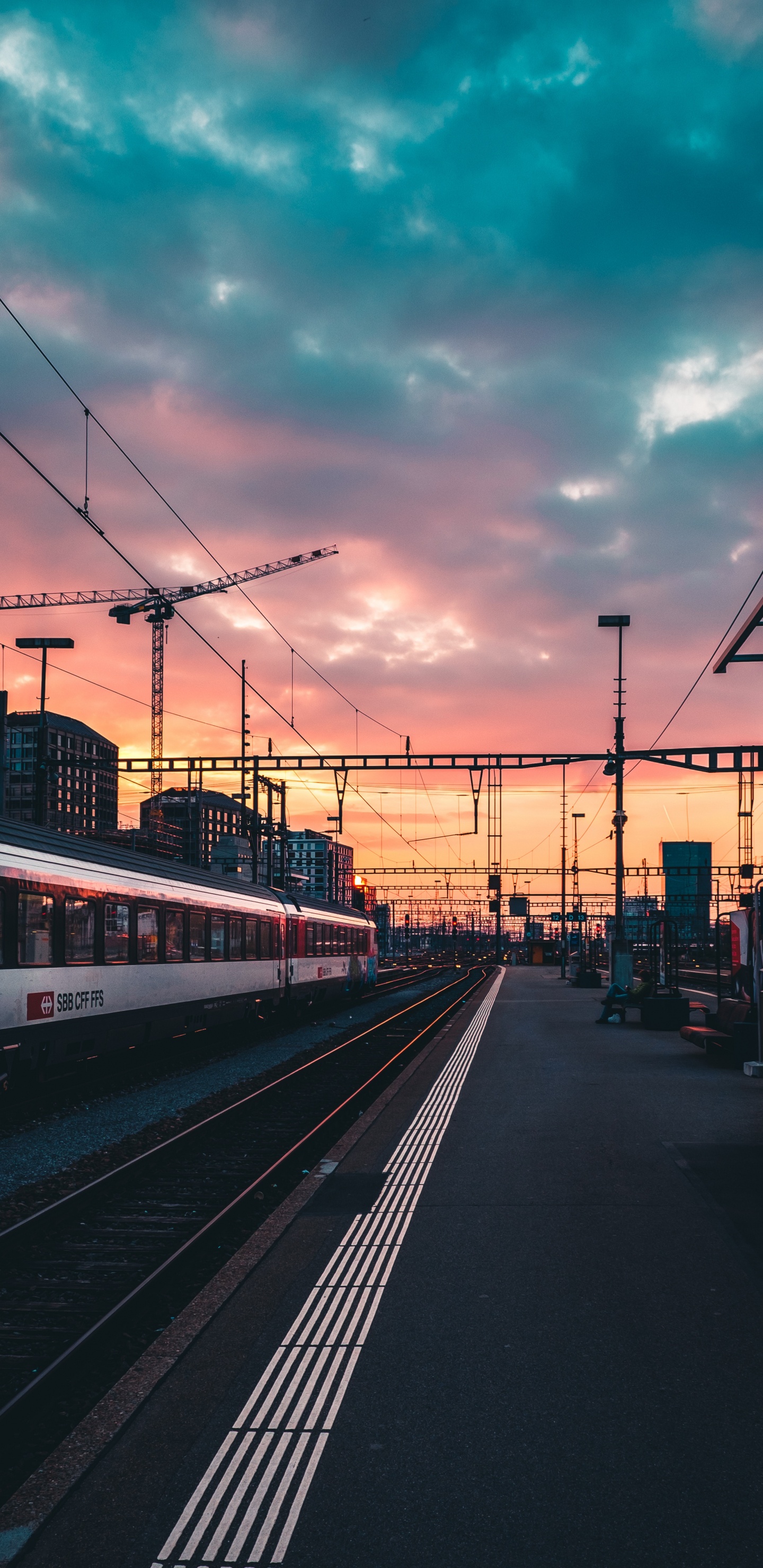 Red and White Train on Rail Road During Sunset. Wallpaper in 1440x2960 Resolution
