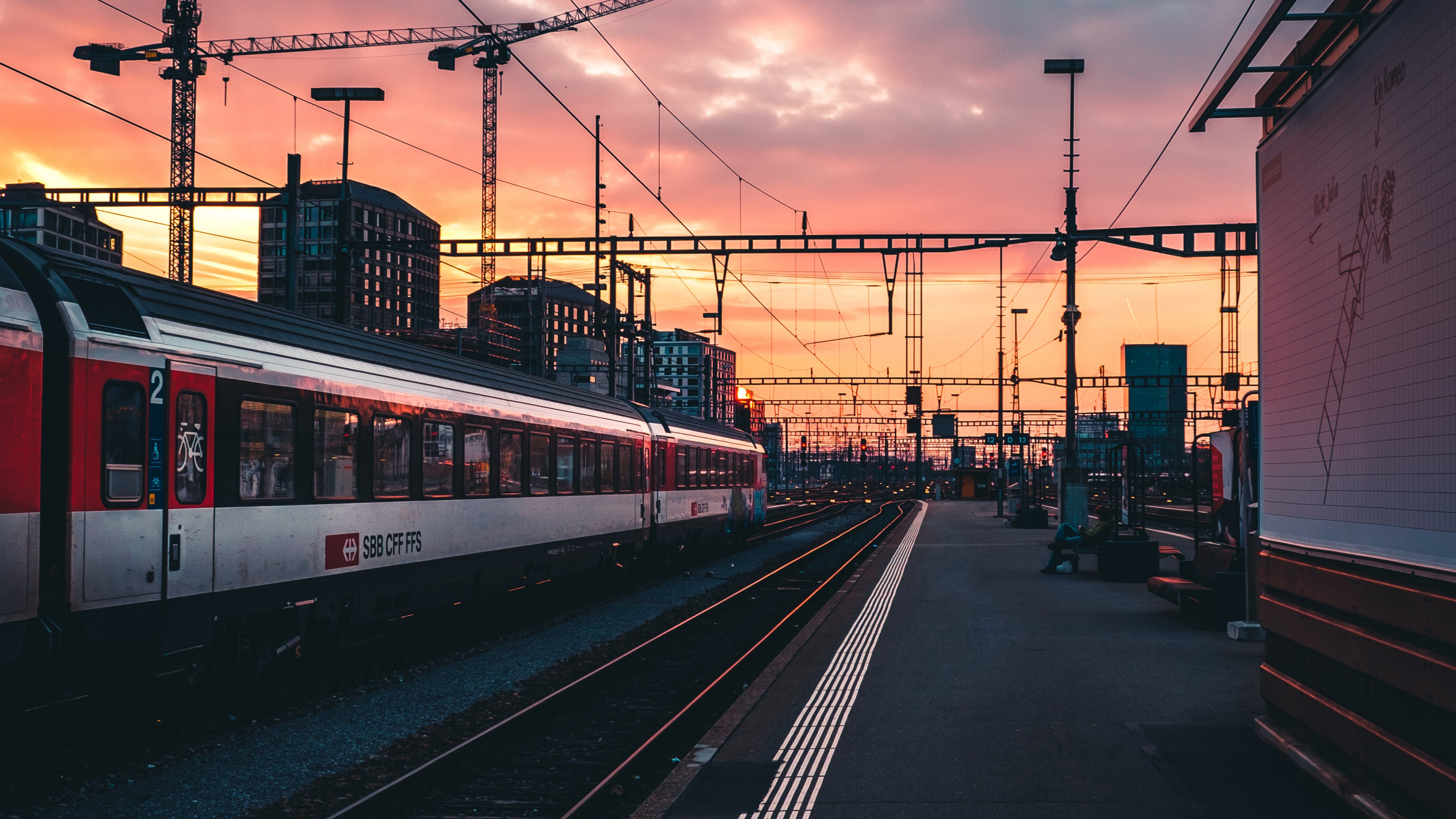 Red and White Train on Rail Road During Sunset. Wallpaper in 3840x2160 Resolution