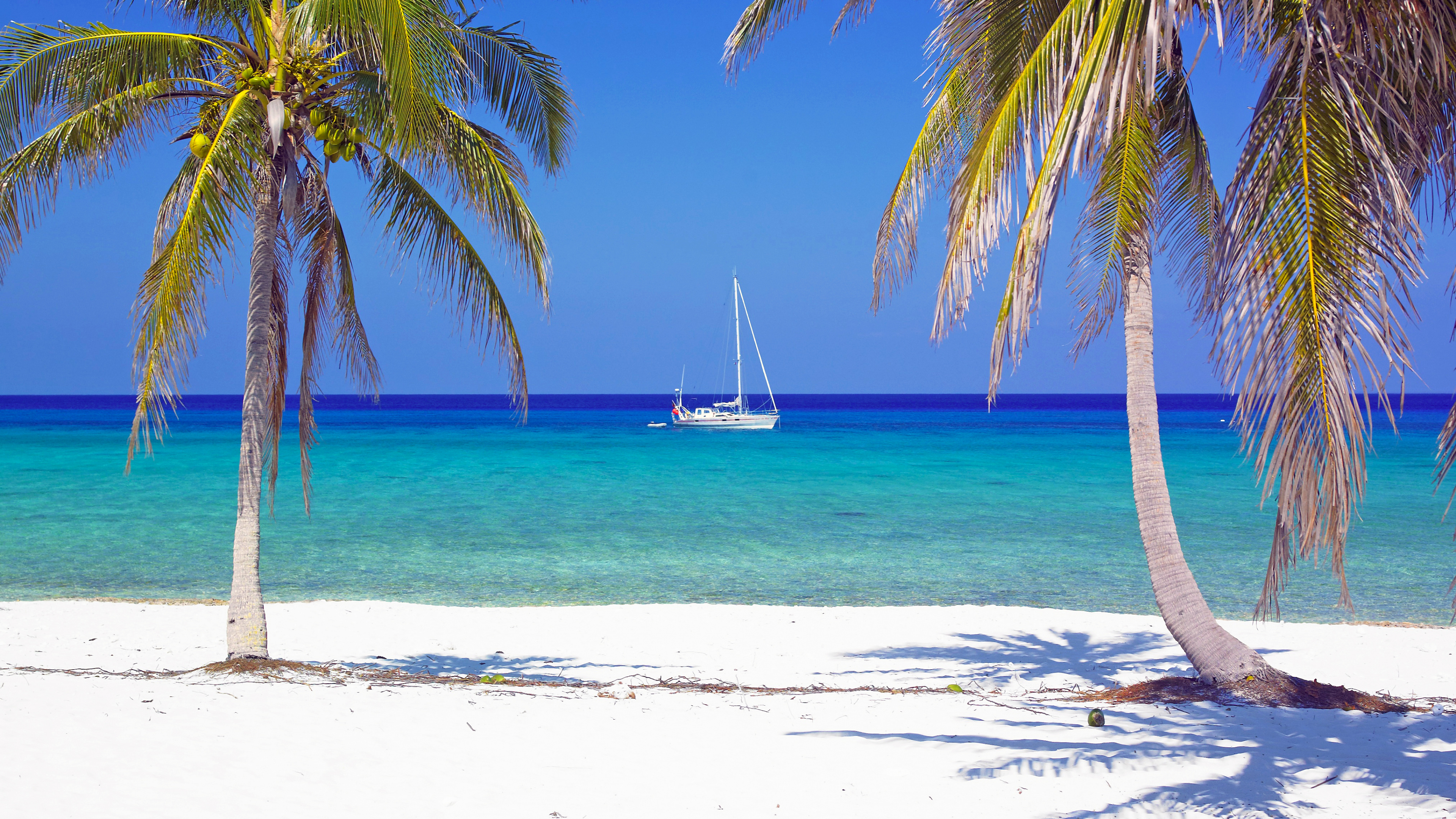 White Sailboat on Sea Shore During Daytime. Wallpaper in 3840x2160 Resolution