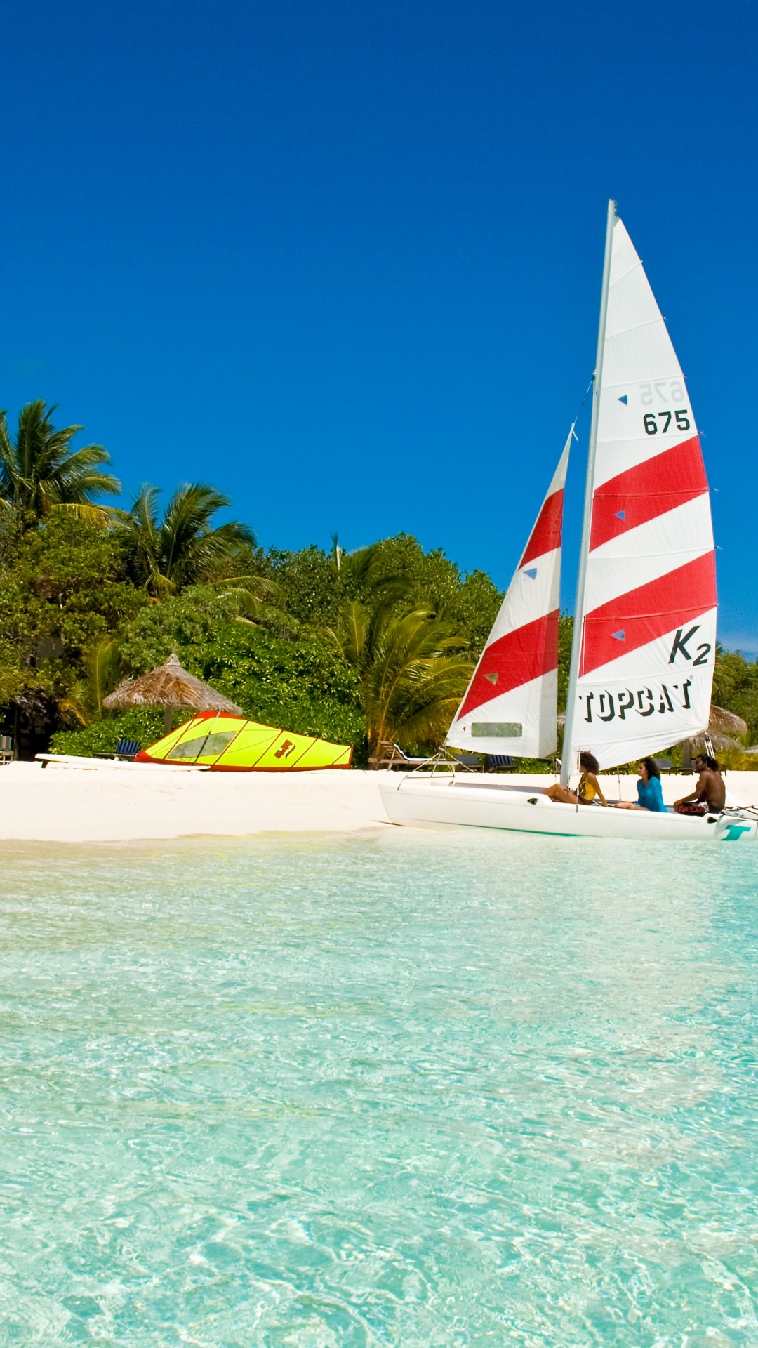 Red White and Blue Sail Boat on Sea Shore During Daytime. Wallpaper in 1080x1920 Resolution